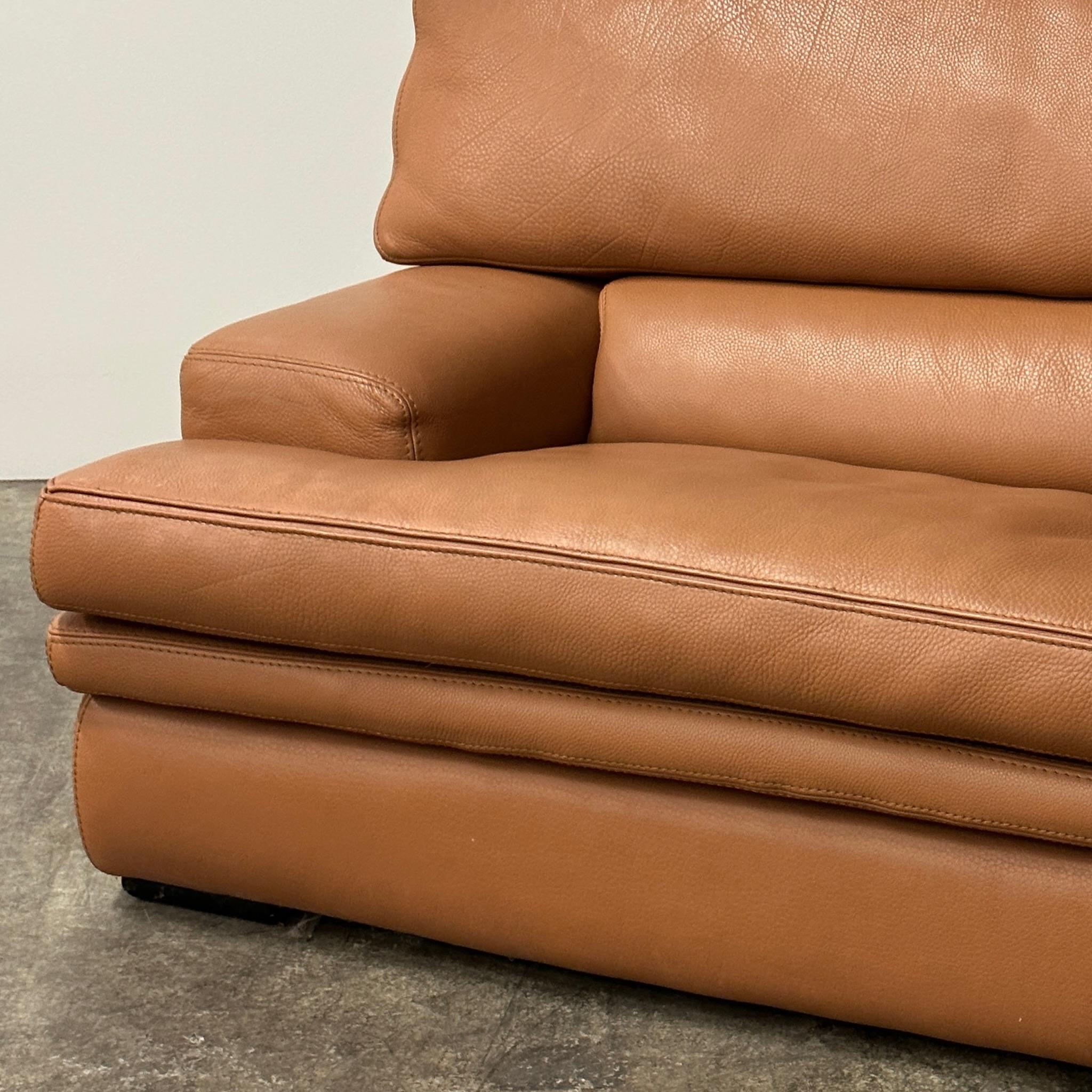 Full leather construction with pockets on the sides. Removable lower cushion to lower seat height. All cushions have zippers. Tagged. 
