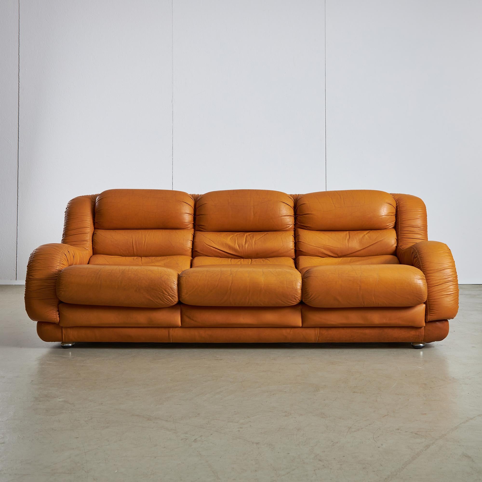 Meet your new favorite lounging spot: a gorgeous 3-seater sofa paired with two beautifully designed armchairs, all wrapped in warm brown leather that just begs you to kick back and relax. This set is all about comfort, with a spacious design that