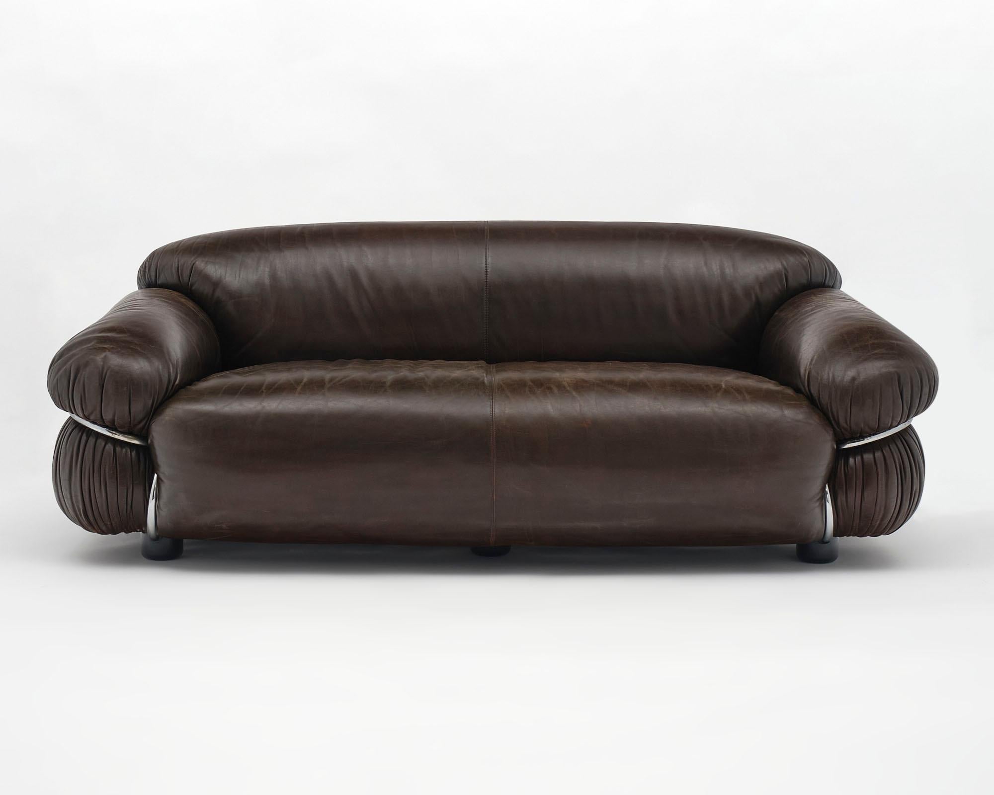 Pair of sofas, Italian, by Gianfranco Frattini and designed for Cassina. The supple leather, in great condition, lends itself to the voluptuous form. These sofas rest in a bent tubular chromed structure that are both in great condition.