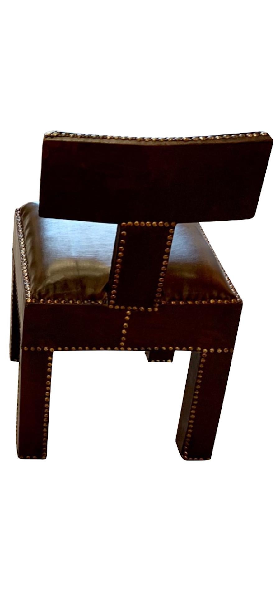 Traditional Moroccan design T-shaped back pair of side chairs
Upholstered all-over in dark brown leather with burnished brass tacks
Also available in black leather (F2673).