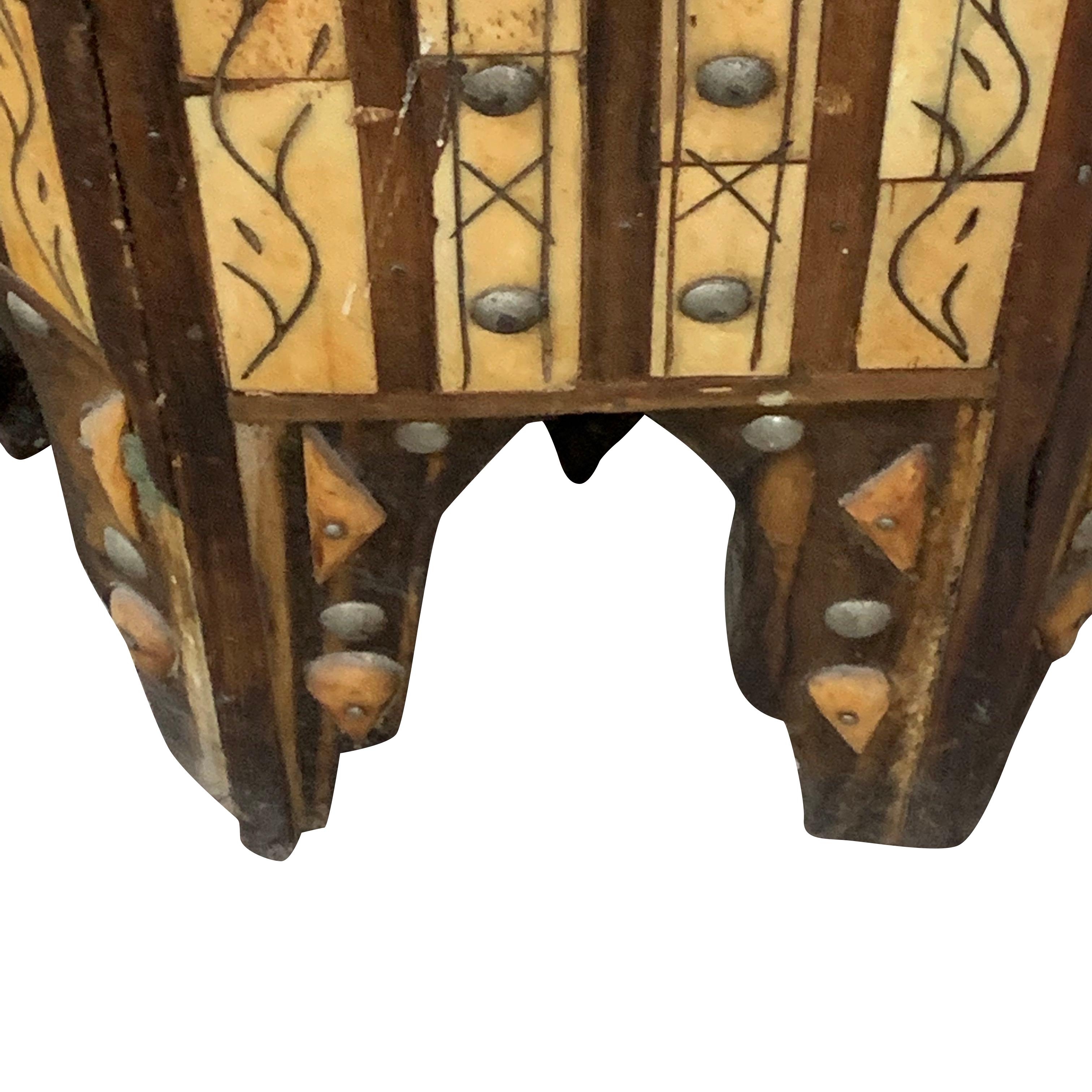 Midcentury Morocco from the Mid Atlas region, octagonal shaped stool with a brown leather top and vertical inlaid bone decorative details.
Cedarwood trim and brass accents.
Two available and sold individually.
  