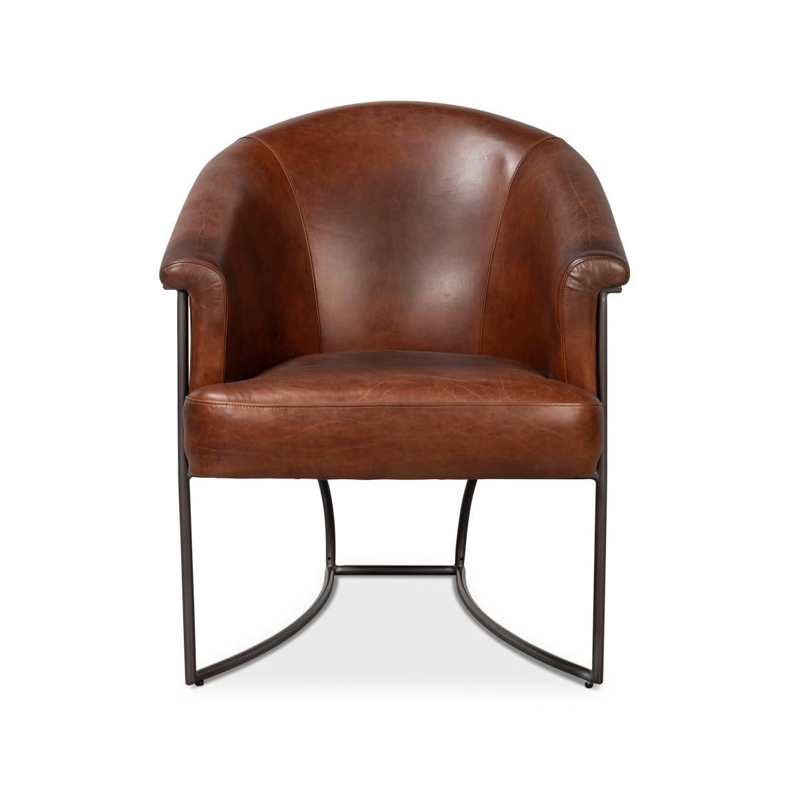 Upholstered in premium full-grain leather in Newark Brown, this chair exudes sophistication and timeless style. The curved tub silhouette provides ergonomic comfort, while the sleek iron frame adds a contemporary edge and sturdy support.

Perfect