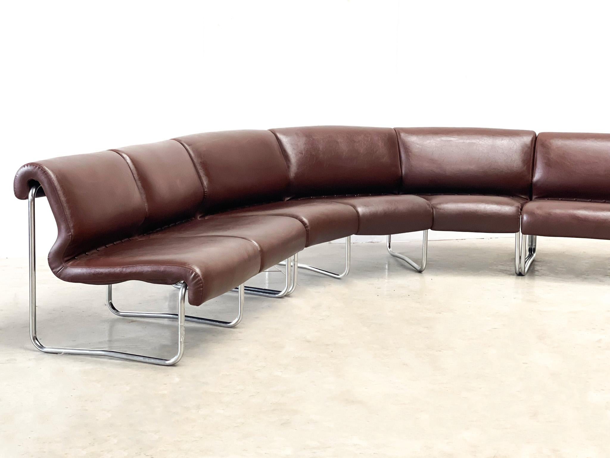 An 1970's modular oak sofa set with an amazing brown leather and  metal frame
The sofa can be configured as shown or in sections around the room. It features a 3 seater, 2 seater and a corner
It is upholstered in a beautiful brown leather with a
