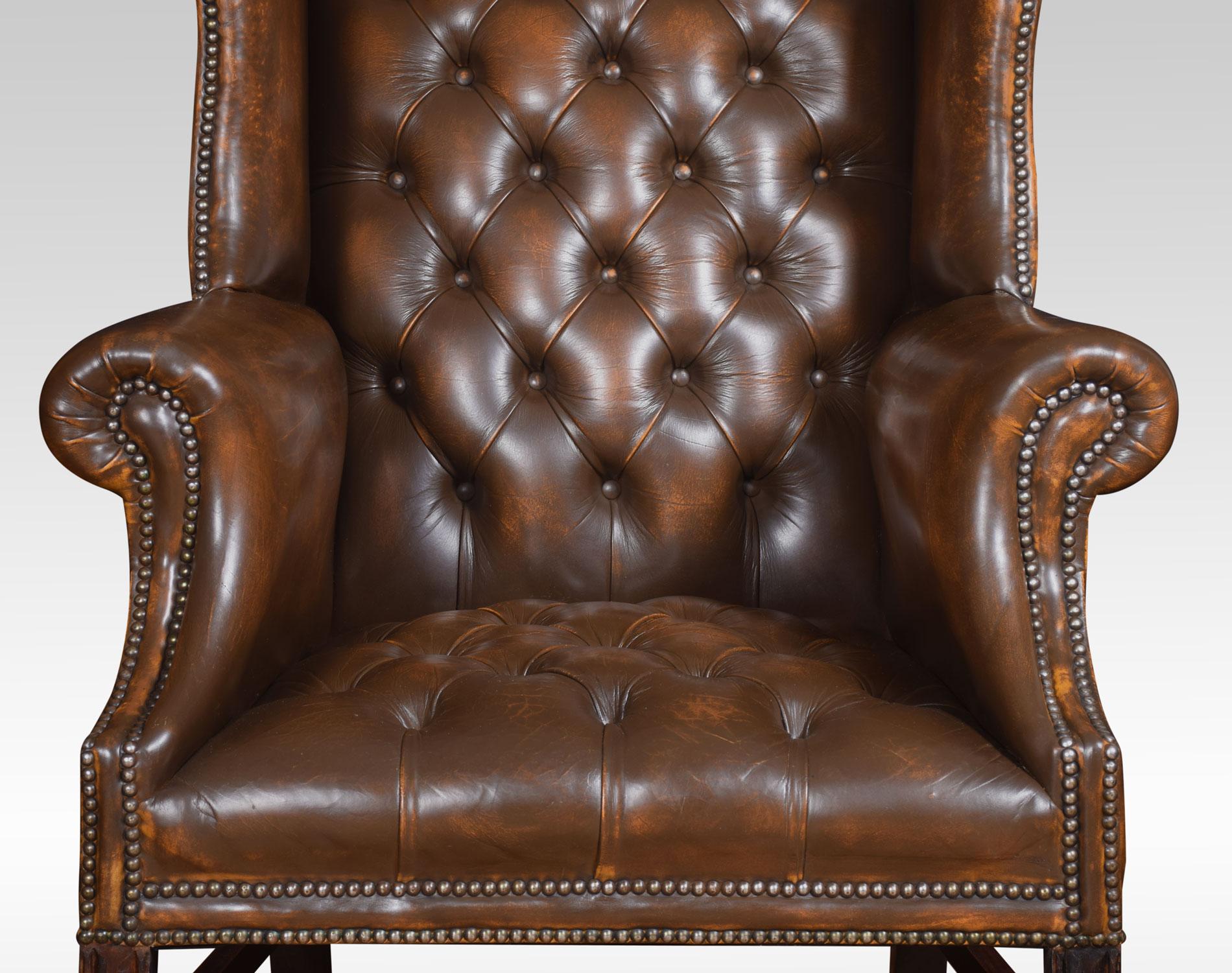brown leather winged armchair