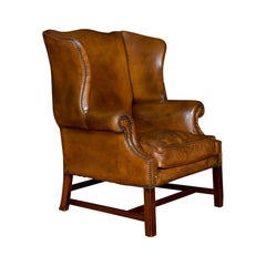 Antique Brown Leather Upholstered Wingback Armchair