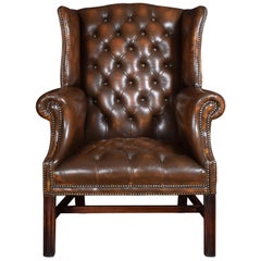Brown Leather Upholstered Wingback Armchair