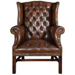 Antique Brown Leather Upholstered Wingback Armchair