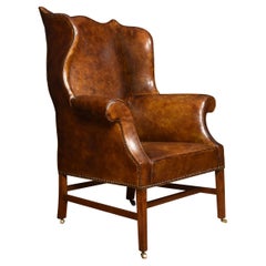 Brown Leather Upholstered Wingback Armchair