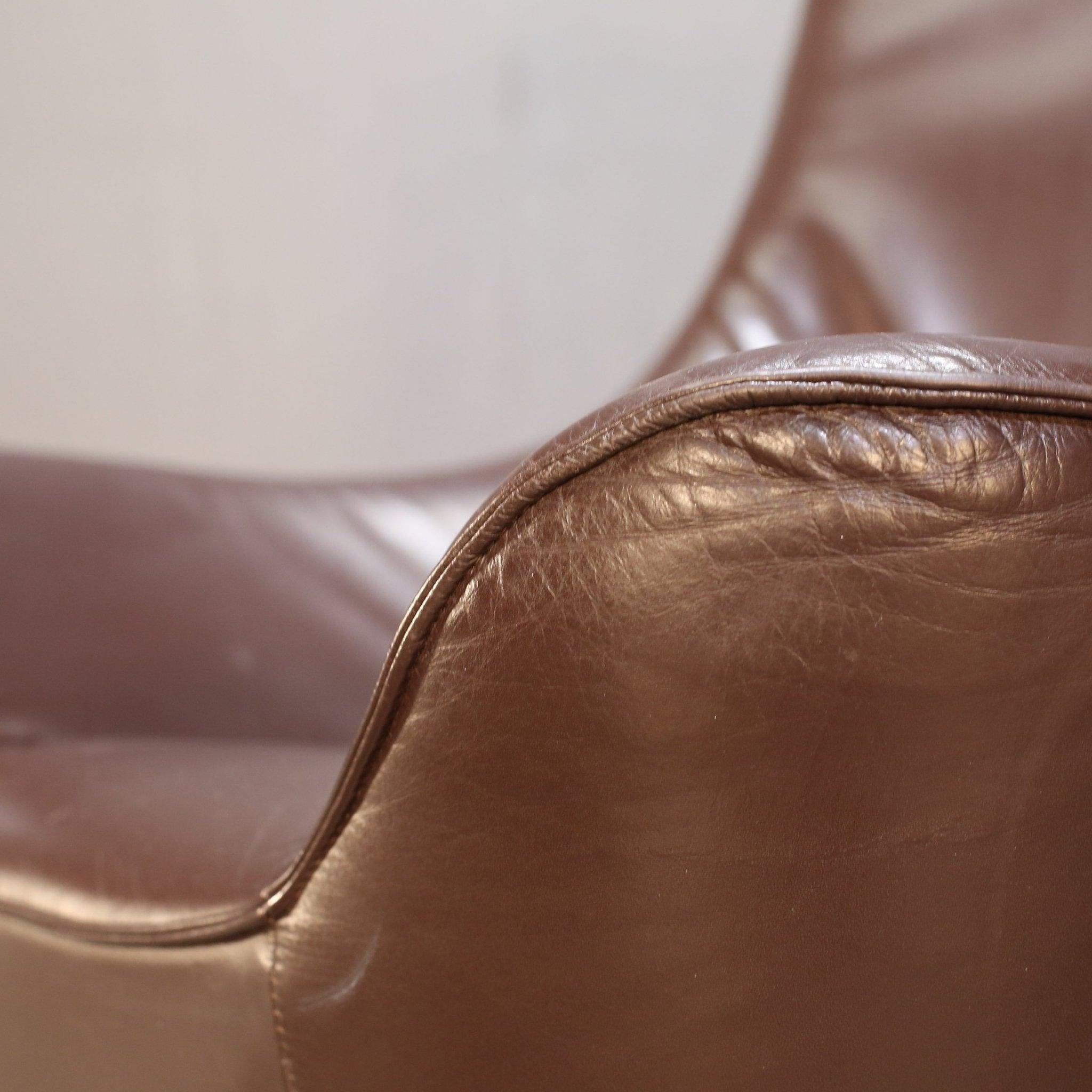 Introducing the ultimate statement piece for your living space - the Leather Wingback Chair by Tom Dixon. Crafted with the finest materials, this chair exudes luxury and sophistication. The sleek leather upholstery adds a touch of elegance, while