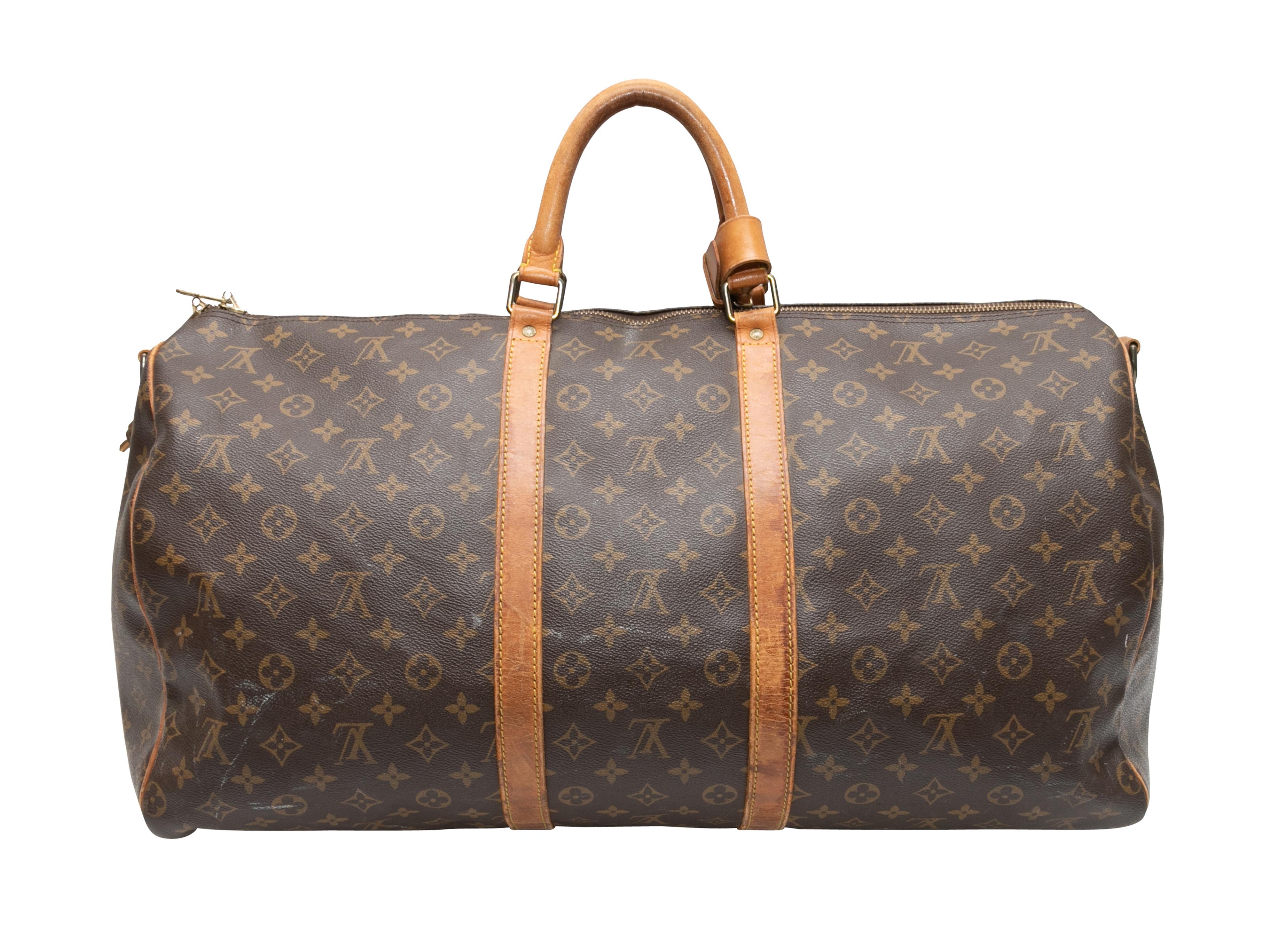 Brown Louis Vuitton 1989 Keepall Bandouliere 45 Bag. The Keepall Bandouliere 45 Bag features a monogram coated canvas body, leather trim, gold-tone hardware, dual rolled top handles, a single shoulder strap, and a top zip closure. 20