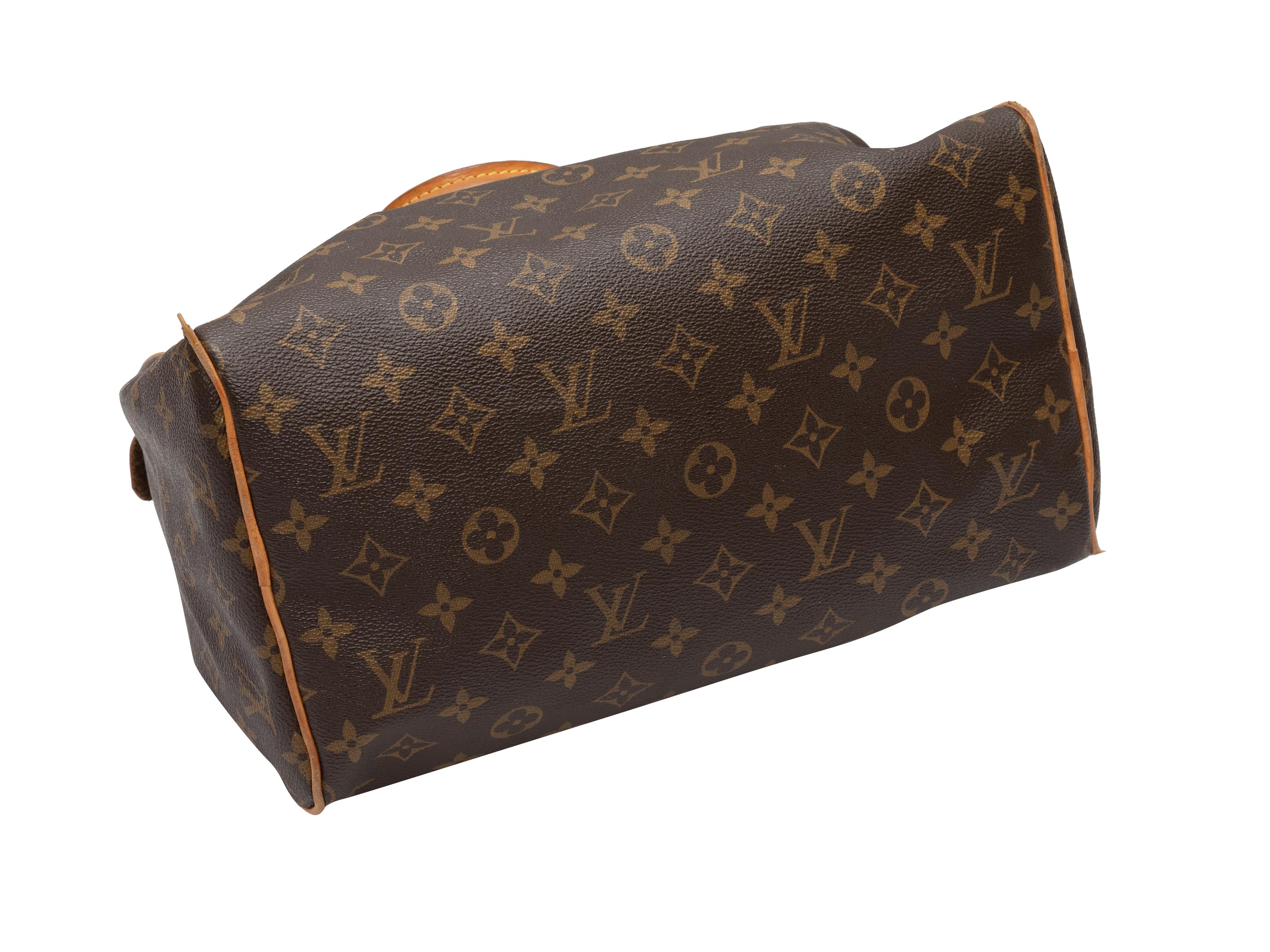 Brown Louis Vuitton 2008 Monogram Speedy 25 Bag. The Speedy 25 Bag features a coated canvas body, gold-tone hardware, dual rolled top handles, and a top zip closure. 12.5