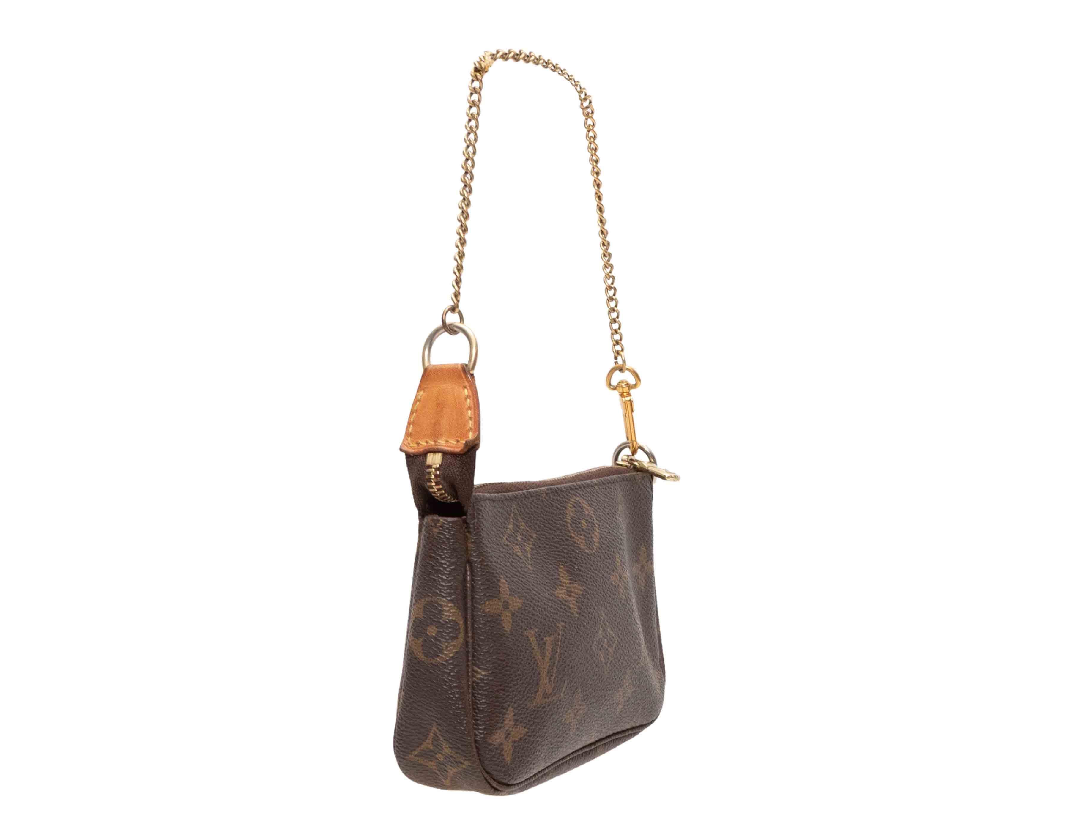 Sac à bandoulière Louis Vuitton Mini Pochette marron. Le sac à bandoulière Mini Pochette se compose d'un corps en toile enduite de monogramme, de ferrures dorées, d'une bandoulière à maillons et d'une fermeture à glissière sur le dessus. 6