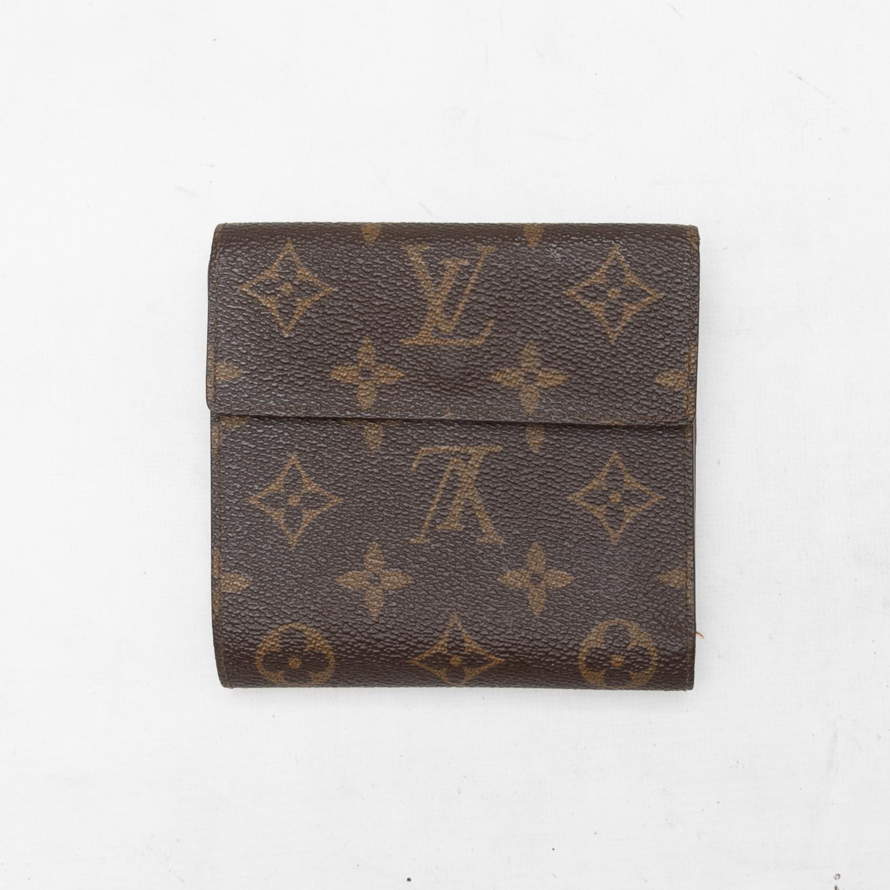Brown monogram folding wallet by Louis Vuitton. Interior card and cash slots. Exterior snap closure. 4.5