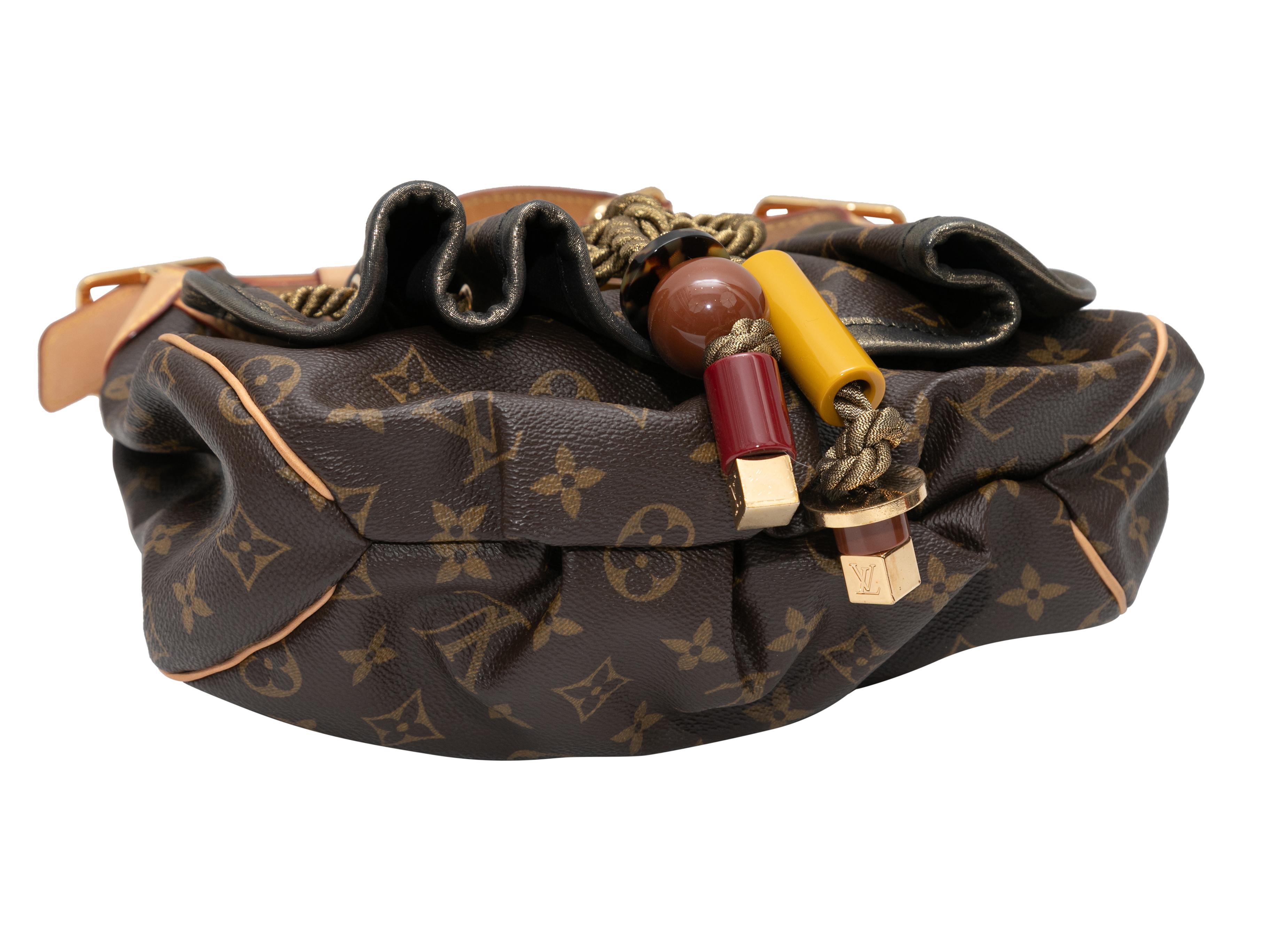 Brown Louis Vuitton Monogram Kalahari PM Bag. The Kalahari PM bag features a monogram coated canvas body, gold-tone hardware, an acrylic bead-accented from flap, a single shoulder strap, and a front closure. 12