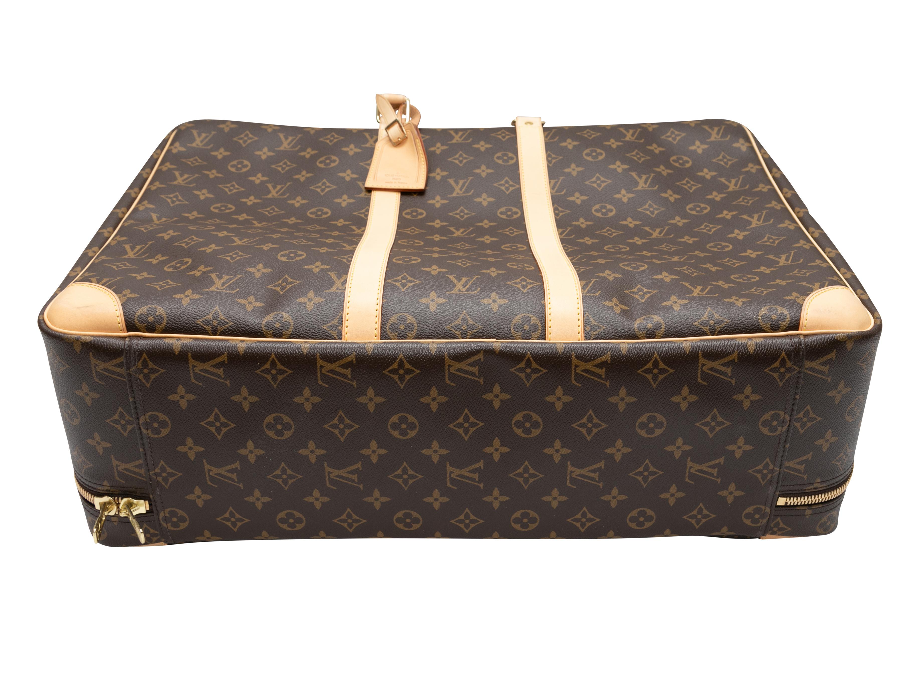 Brown Louis Vuitton Monogram Large Soft Trunk. This trunk features a coated canvas body, leather trim, gold-tone hardware, dual rolled top handles, and a top zip closure. 21.25