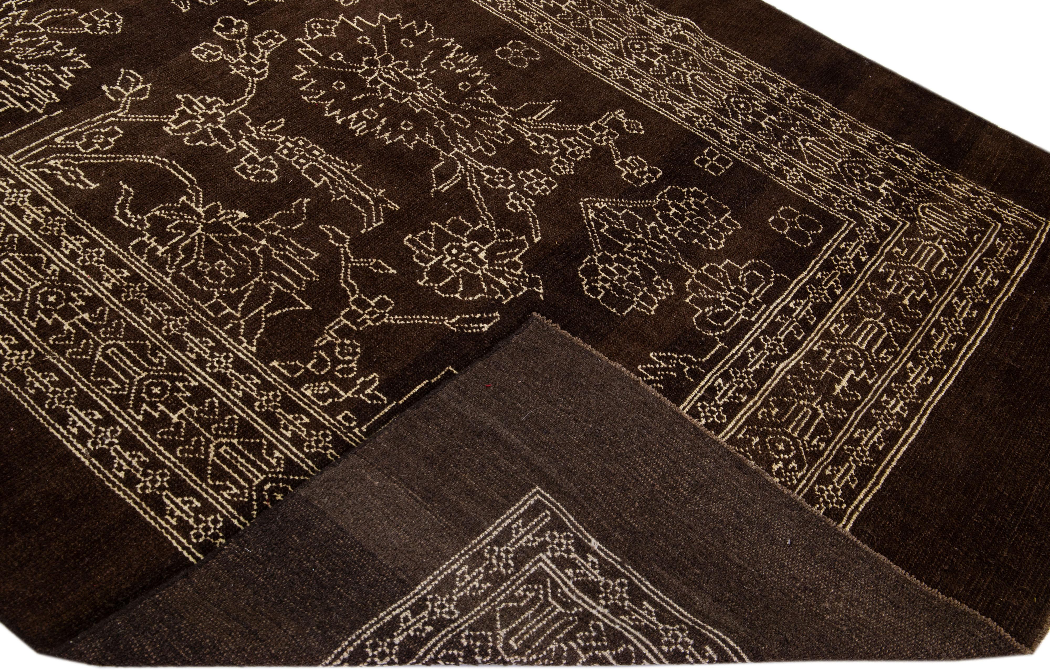 Beautiful Mid-Century Modern style rug Inspired by 19th-century regional artisans -- embodies a Classic, transitional look and modern style. This handmade wool rug makes part of our Northwest collection and features a dark brown color field and