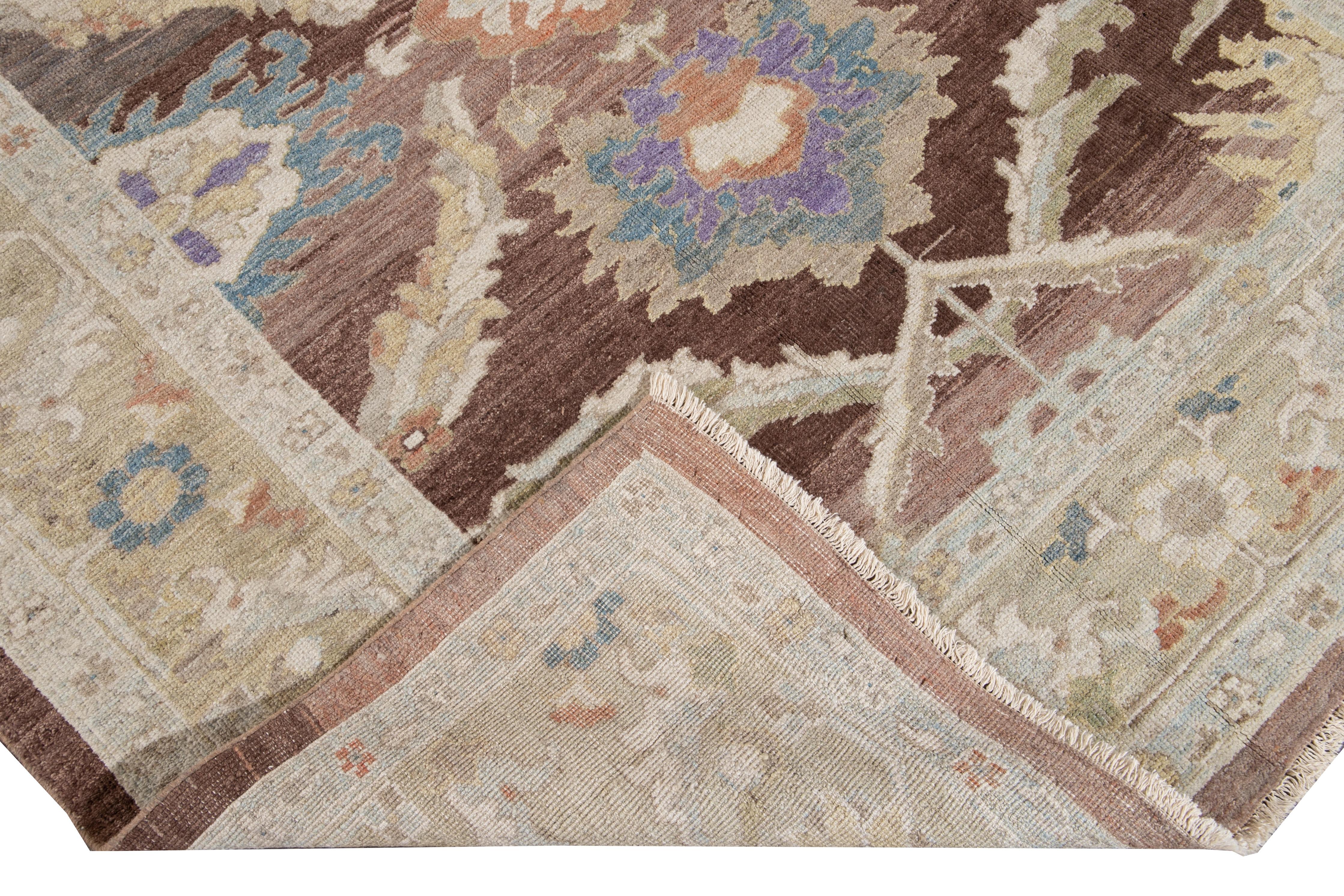 Beautiful Modern Sultanabad hand knotted wool rug with a brown field. This Sultanabad rug has a beige frame and a multi-color accent in a gorgeous all-over Classic floral medallion design.

This rug measures: 6'2