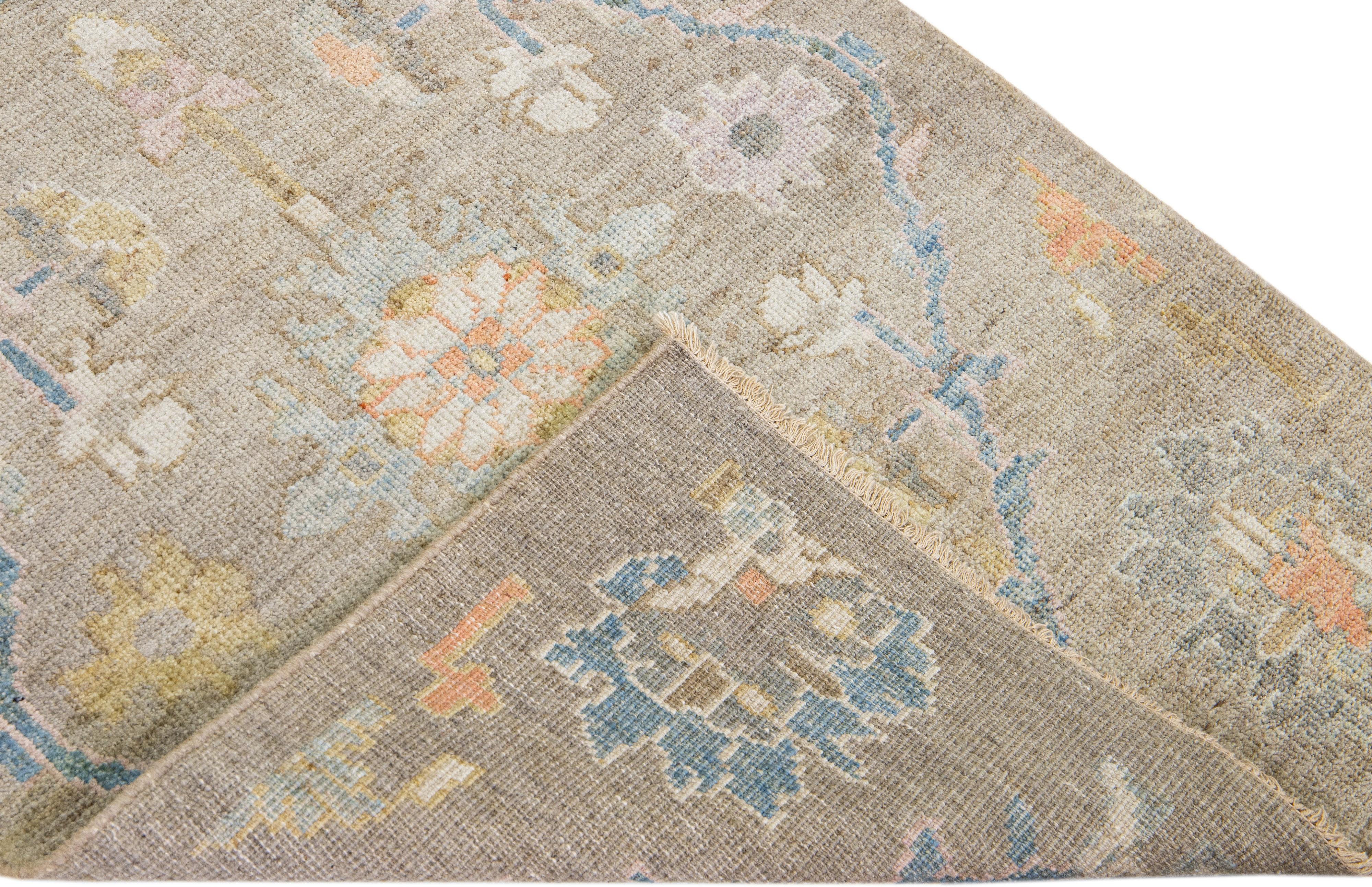 Beautiful modern Mahal hand-knotted wool runner with a brown field. This Piece has multicolor accents in a gorgeous all-over Classic floral design.

This rug measures: 2'9