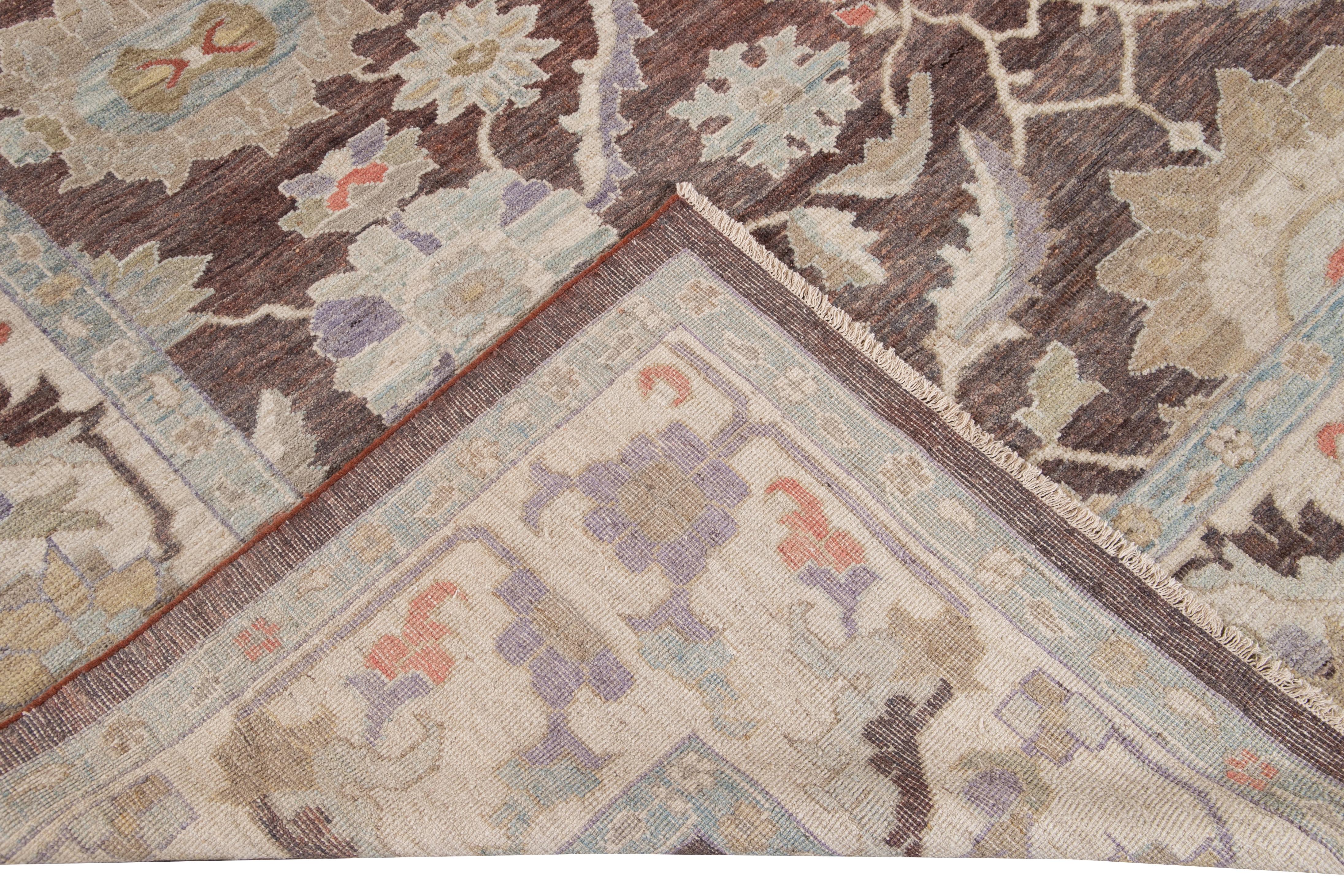 Beautiful modern Sultanabad oversize hand knotted wool rug with a beige field. This Sultanabad rug has a beige frame and blue, orange, purple, and yellow accent in a gorgeous all-over Classic floral medallion design.

This rug measures: 12'1