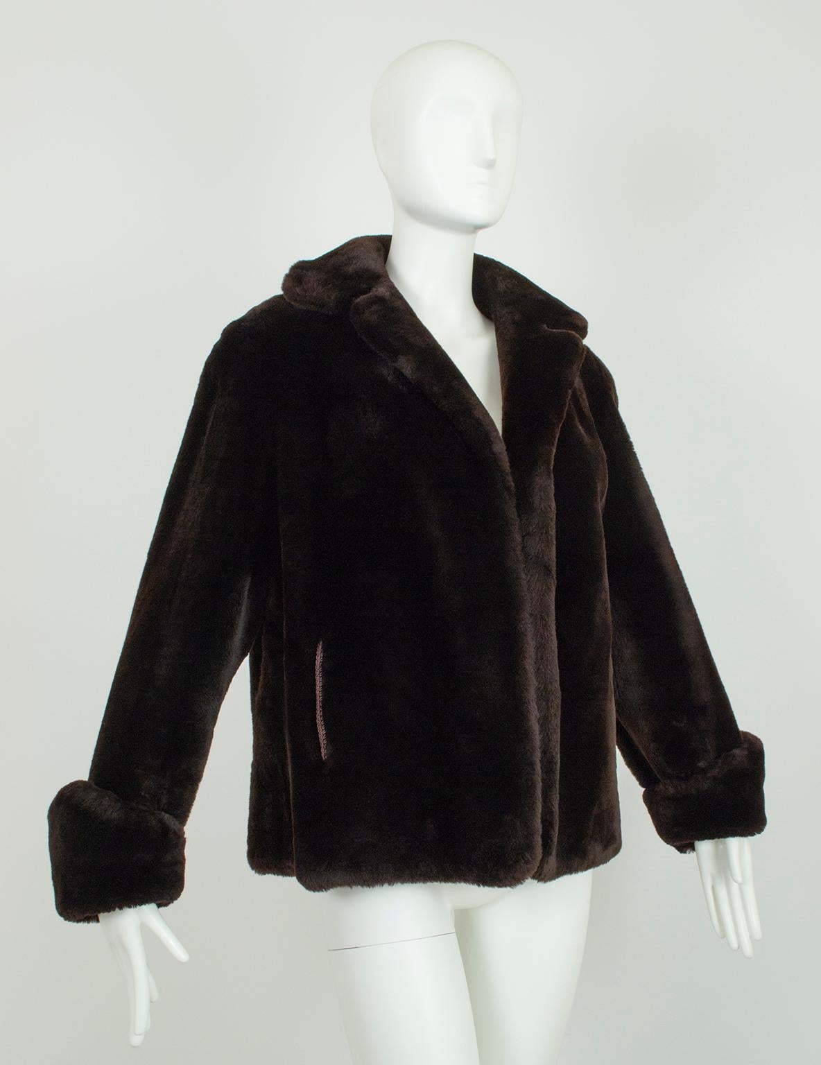 Built for frigid winters and as plush and comforting as a teddy bear, this mouton swing jacket features a saturated deep brown color with the slightest hint of silky sheen. In a rare and wearable larger size its voluminous sweep would look heavenly