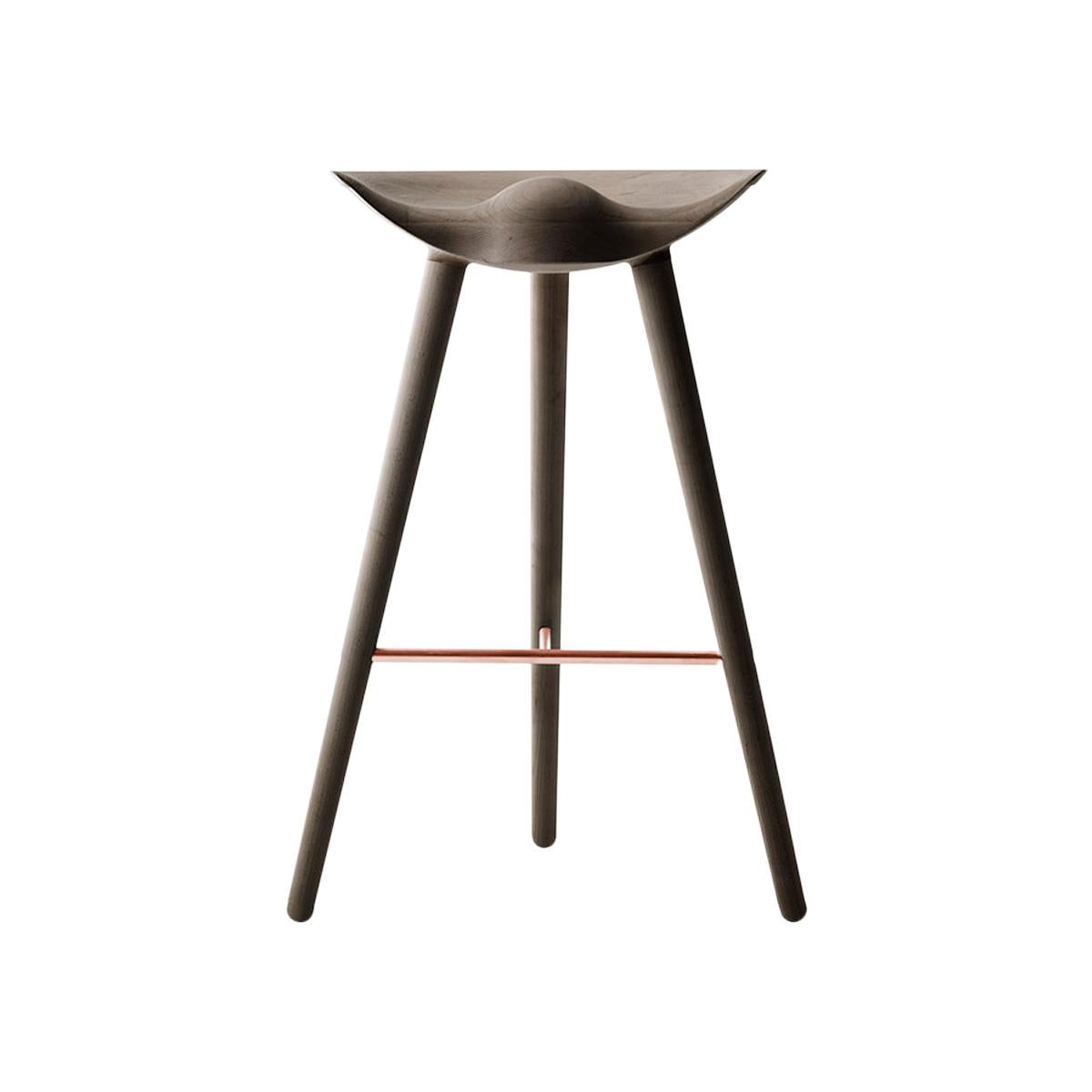 ML 42 Brown oak and copper bar stool by Lassen
Dimensions: H 77 x W 36 x L 55.5 cm
Materials: oak, brass

In 1942 Mogens Lassen designed the Stool ML42 as a piece for a furniture exhibition held at the Danish Museum of Decorative Art. He took