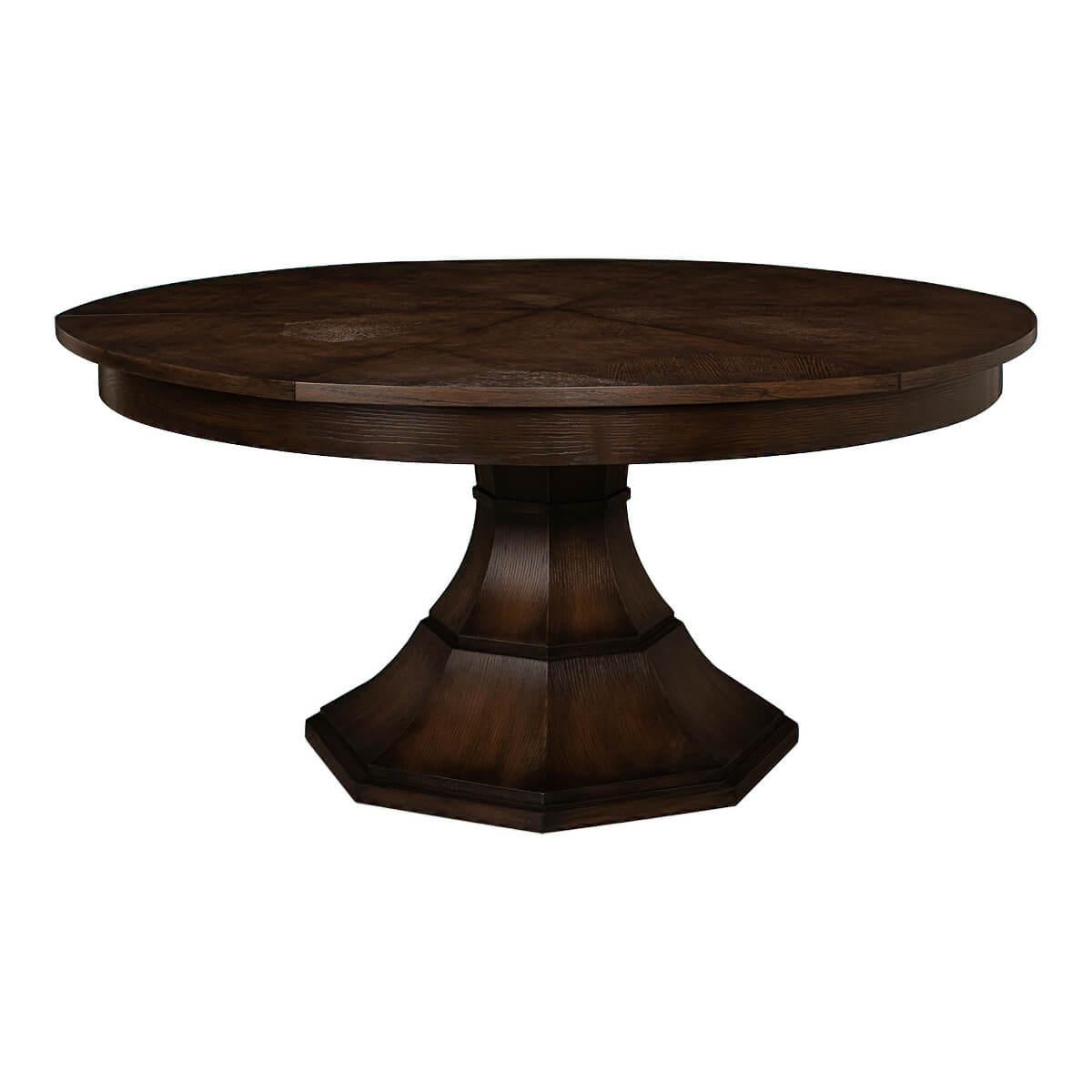 Modern round dining table modern round burnt brown oak veneered extension dining table with self-storing leaves, on a tapered column form pedestal base.

Open dimensions: 70