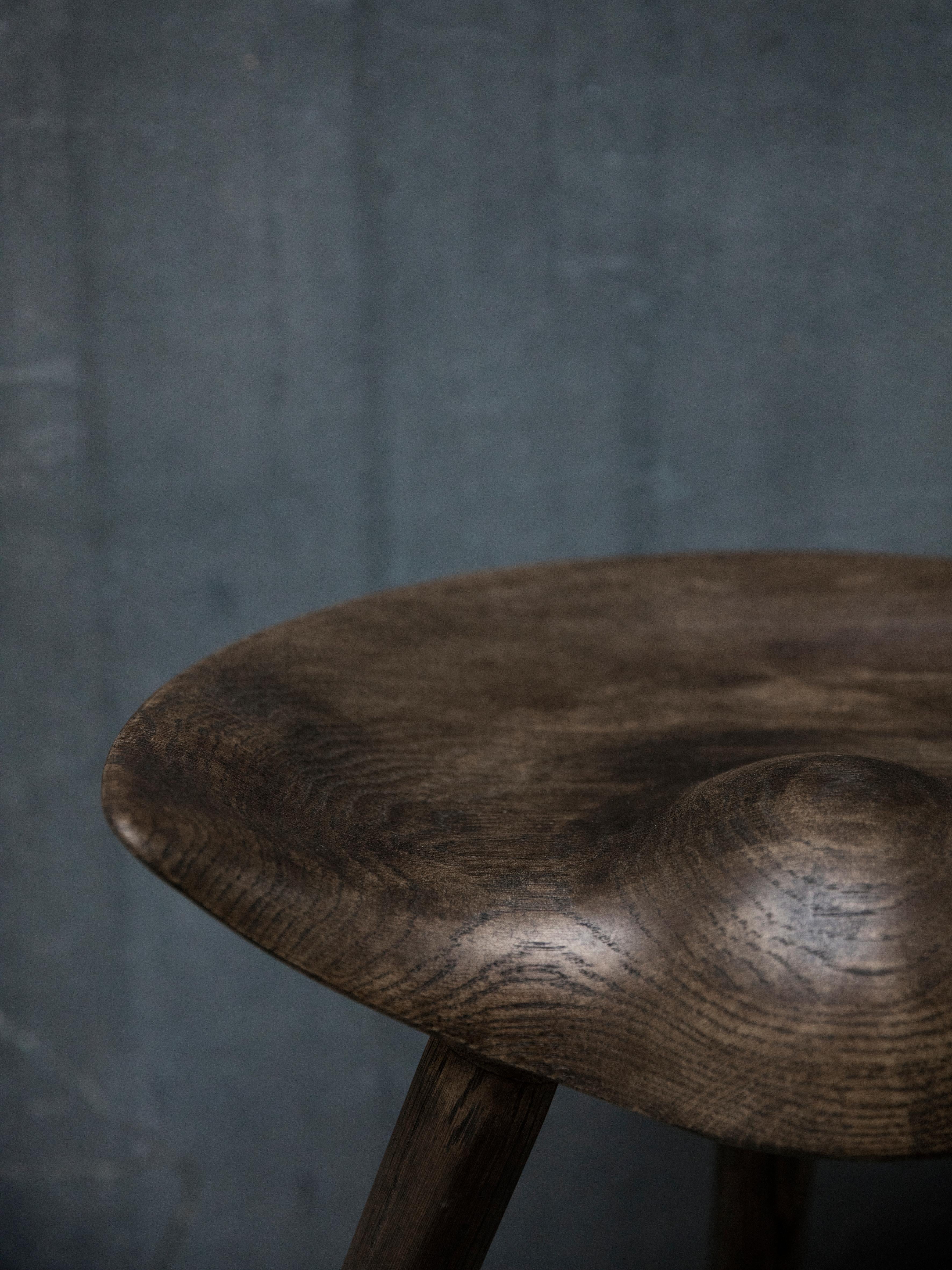 Brown oak stool by Lassen
Dimensions: H 48 x W 36 x L 55.5 cm
Materials: Oak

In 1942 Mogens Lassen designed the Stool ML42 as a piece for a furniture exhibition held at the Danish Museum of Decorative Art. He took inspiration from the stools