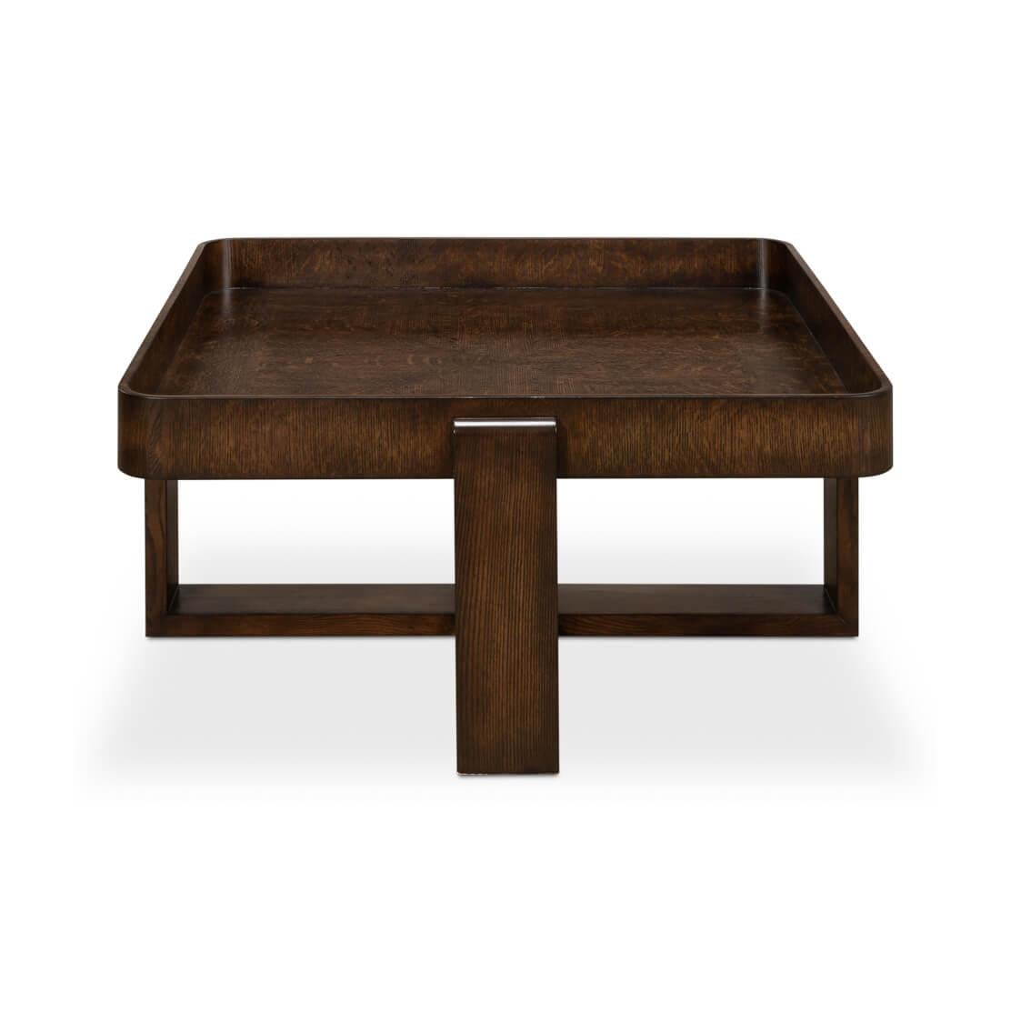 This table is a substantial centerpiece, crafted from oak, its generous tray top features raised edges, perfect for holding drinks and decorative items securely.

Below, the substantial X-shaped base anchors the table, with legs that extend outward,
