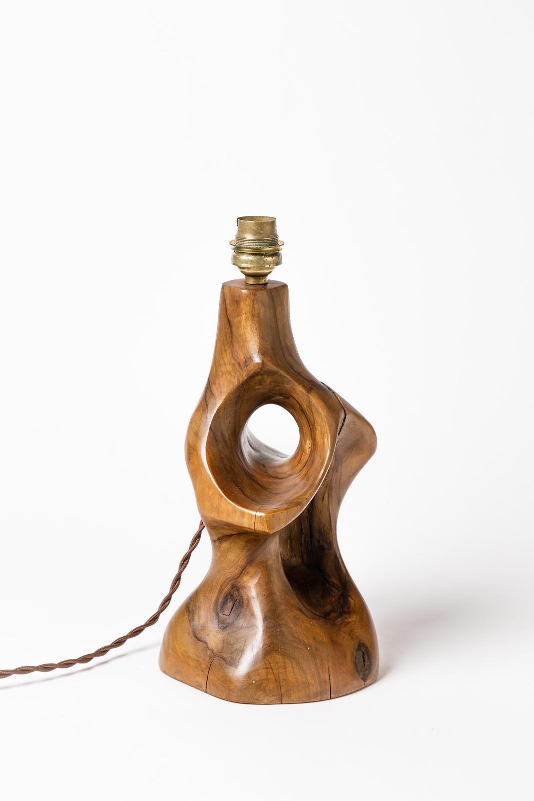 Olive wood table lamp,

circa 1950

French abstract free form in olive wood with beautiful brown original color.

New and functional electric system

Sold without lampshade

Measures: Height (wood part) 24cm, large 14cm
Height (with metal