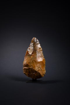Brown-Orange Hand Axe made by Early Humans