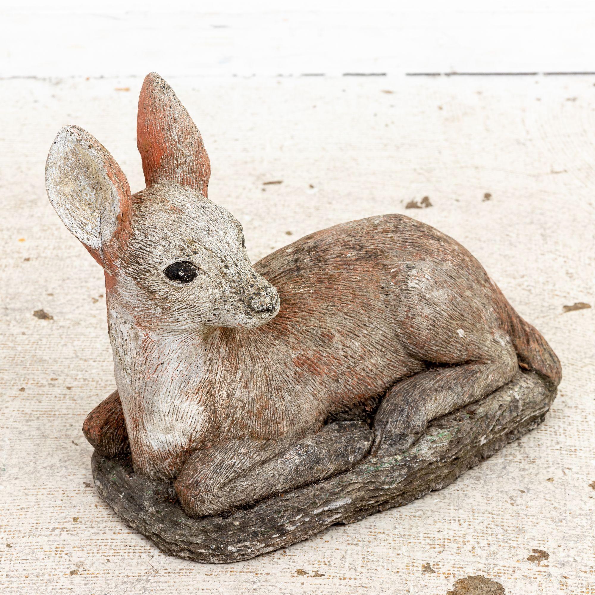 Transport yourself to the enchanting gardens of the mid-20th century with this exquisite French garden ornament in the shape of a doe or deer. Crafted with meticulous attention to detail and recreating a lifelike coat, this captivating sculpture