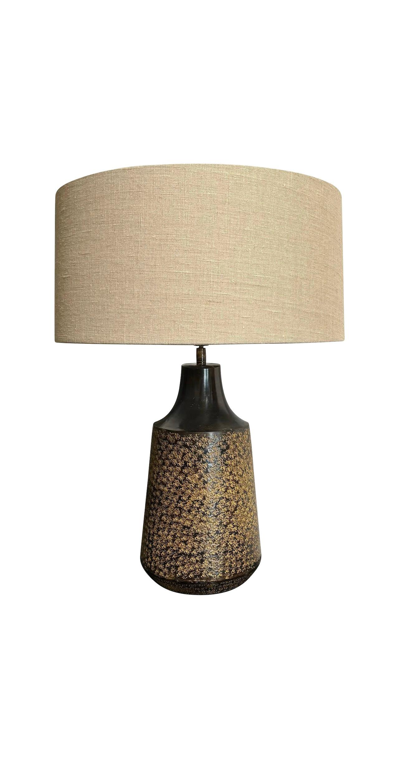 Contemporary Chinese pair textured metal lamps.
Top of base has mottled decorative pattern design.
Belgian linen shades included.
Shade base measures 19.5