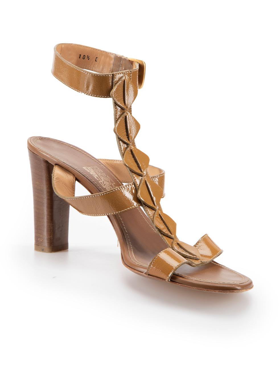 CONDITION is Very good. Minimal wear to shoes is evident. Minimal wear to both heels with indents and scratches on this used Salvatore Ferragamo designer resale item.



Details


Brown

Patent leather

Heeled sandals

Open-toe

Adjustable ankle