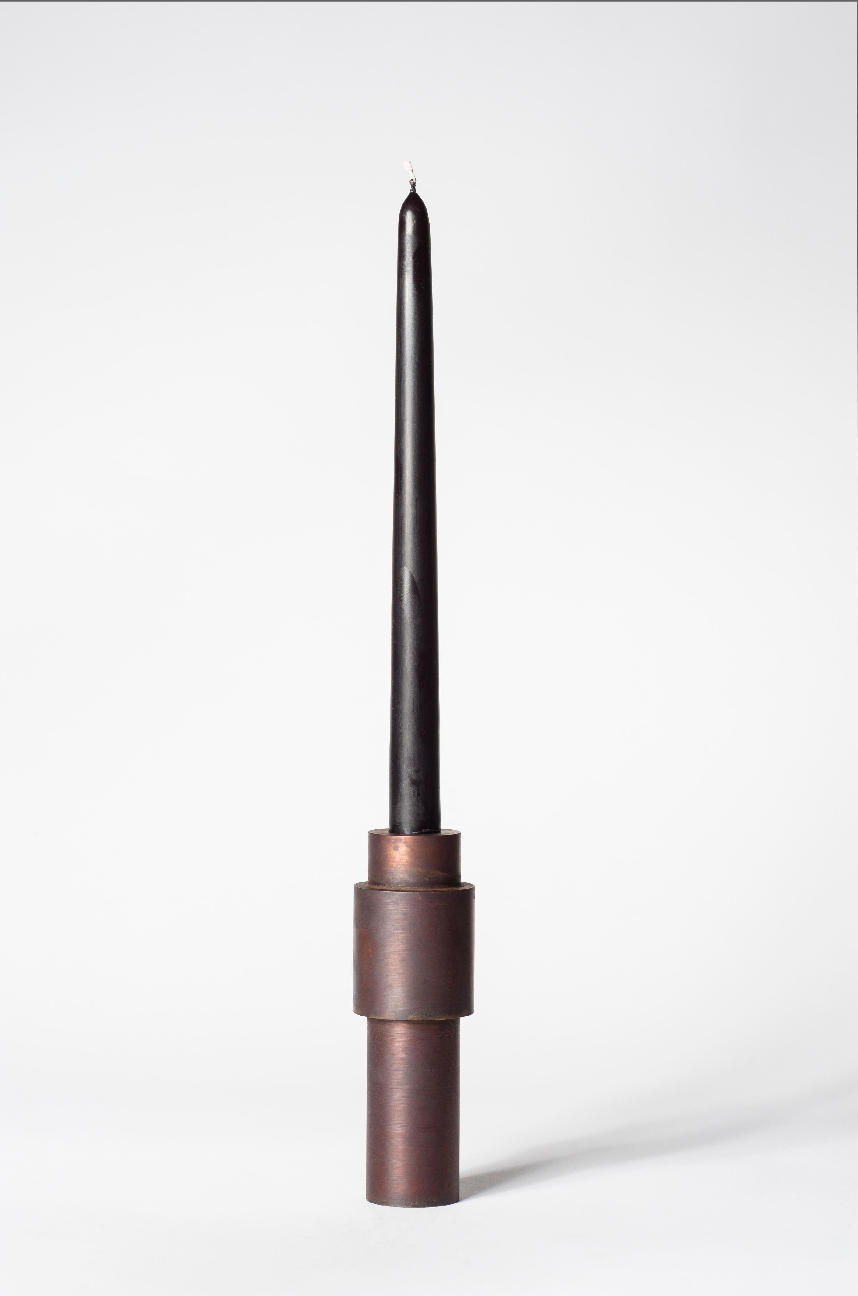 Brown patina steel candlestick by Lukasz Friedrich
Dimensions: D 5 x H 15 cm
Materials: Brown patina on steel.
