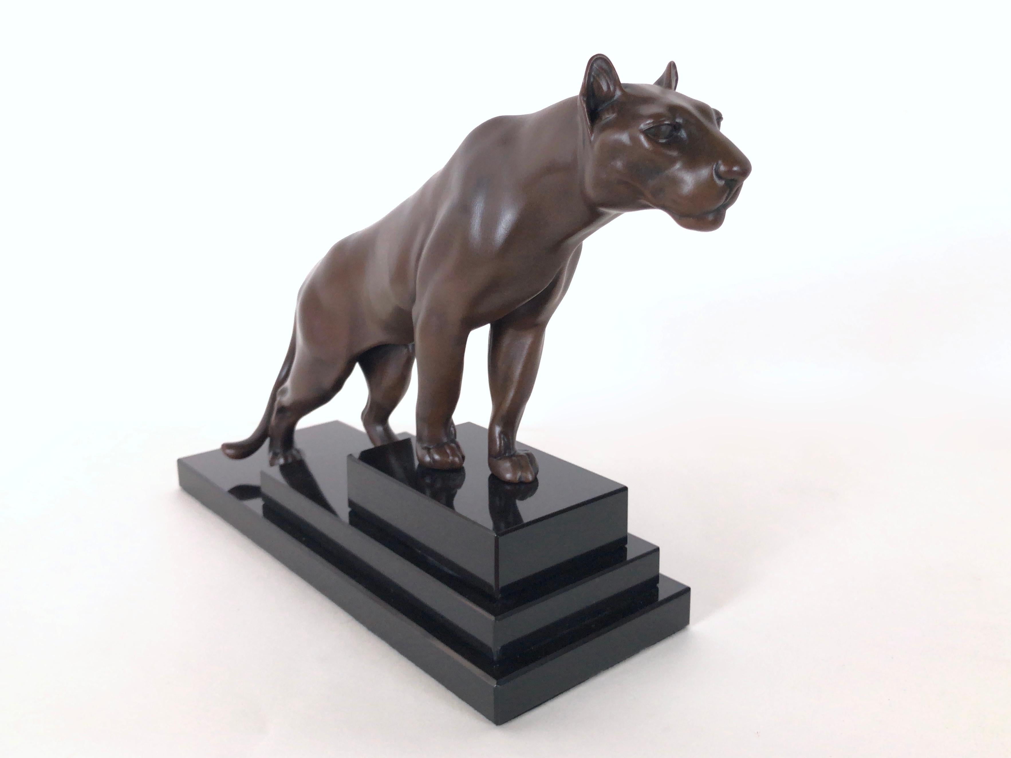 Lion / panther sculpture named “Jungle” on a stepped marble base. 
Original “Max Le Verrier”, signed 
Designed in France during the roaring 1920s by “Max Le Verrier” (1891-1973) 
Art Deco style, France 

Sculpture made in “Régule” (spelter)