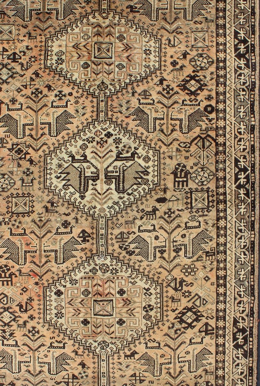 Peach, Brown, Taupe Vintage Persian Shiraz rug with Vertical Sub-Geometric Medallions, Keivan Woven Arts / rug H-1211-56, country of origin / type: Iran / Shiraz, circa 1950

This vintage Persian Shiraz rug (circa 1950) features a unique blend of