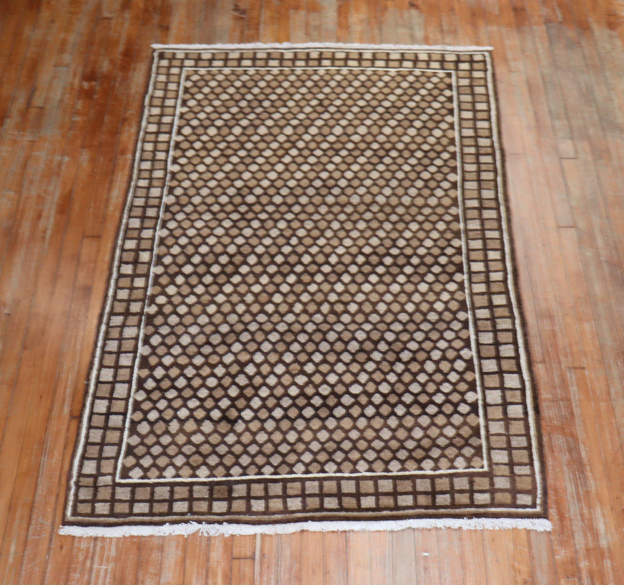 One of a kind Persian Deco rug in various shades in brown

Measures: 4'1” x 6'3”.
   