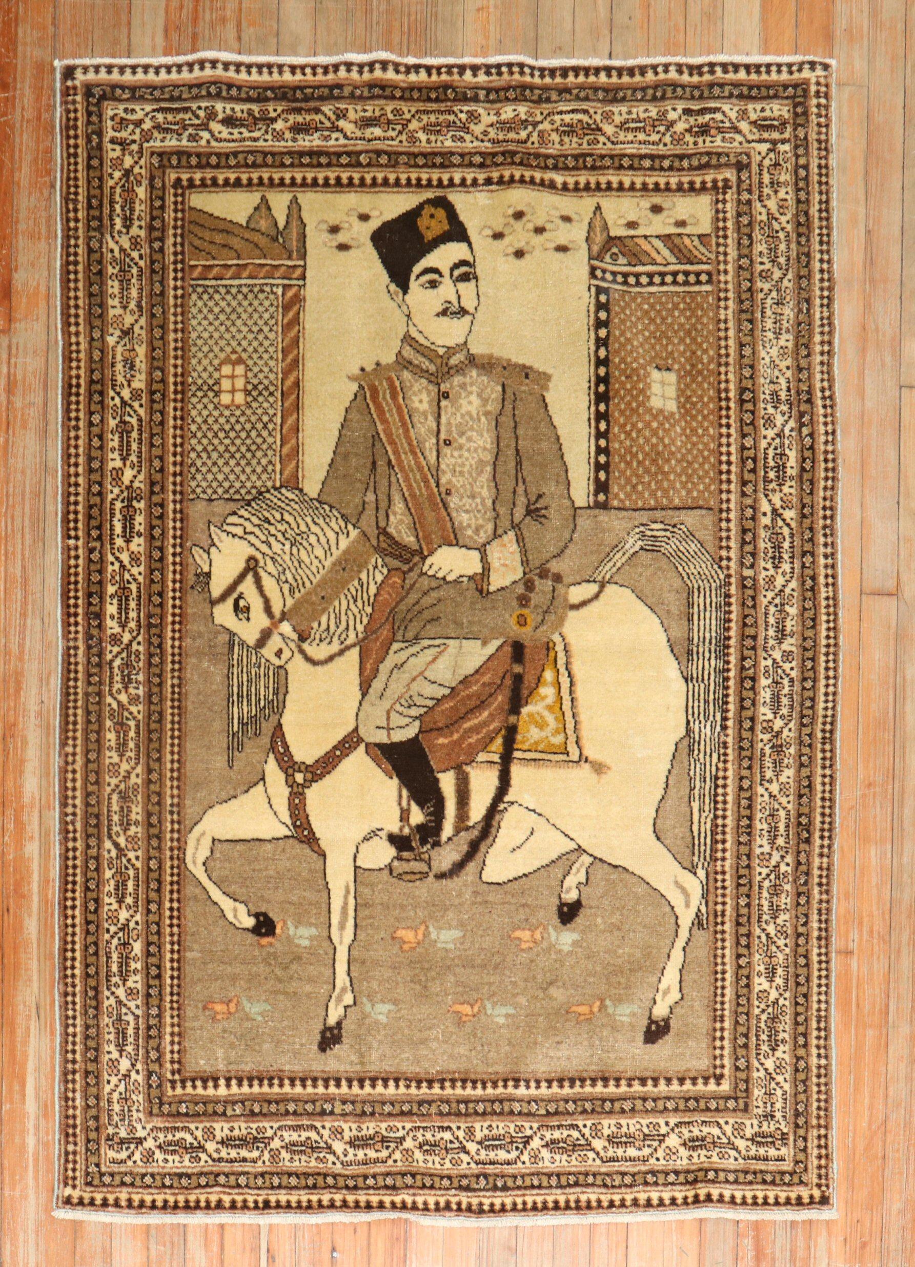 An early 20th Century Persian Tabriz rug with a Persian man riding on his horse.

4' x 5'8''