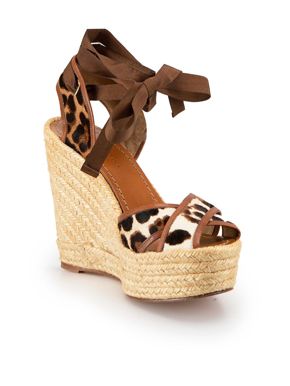 CONDITION is Very good. Minimal wear to shoes is evident. Minimal wear to both wedge heels with scuff marks on this used Dolce & Gabbana designer resale item.



Details


Brown

Pony hair

Espadrille wedges

High heeled

Leopard
