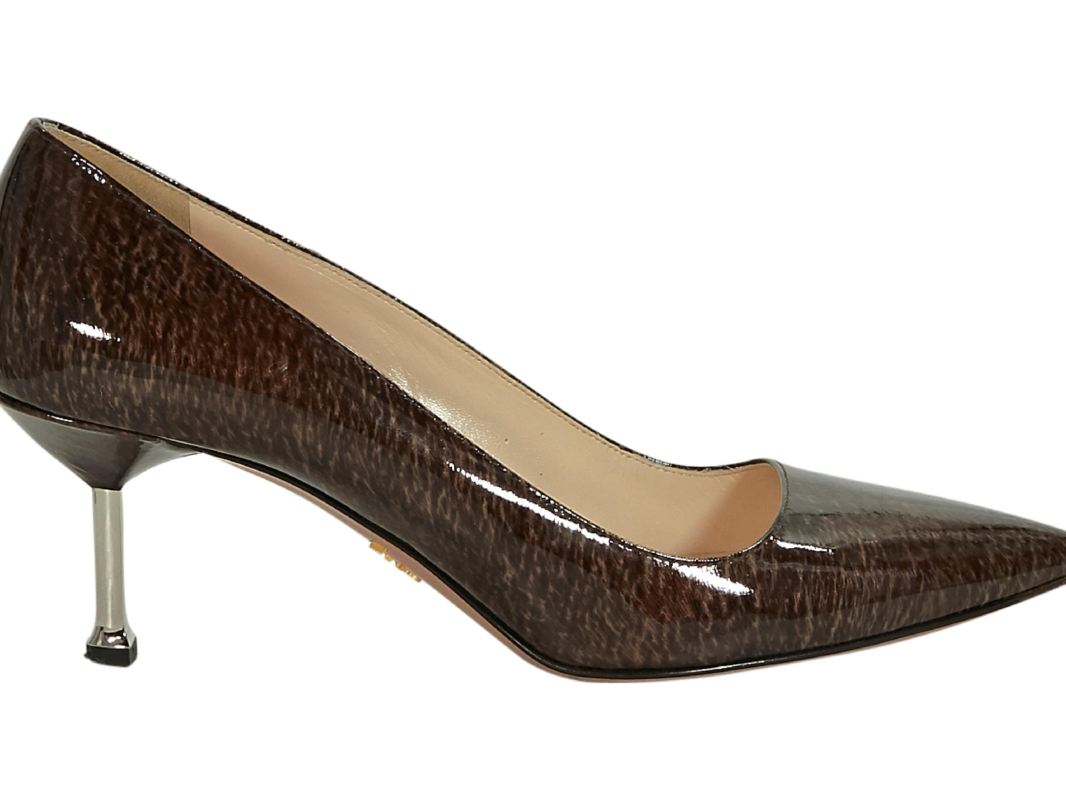 Product details:  Brown printed patent leather pumps by Prada.  Metal kitten heel.  Silvertone hardware.  Slip-on style.  2.5