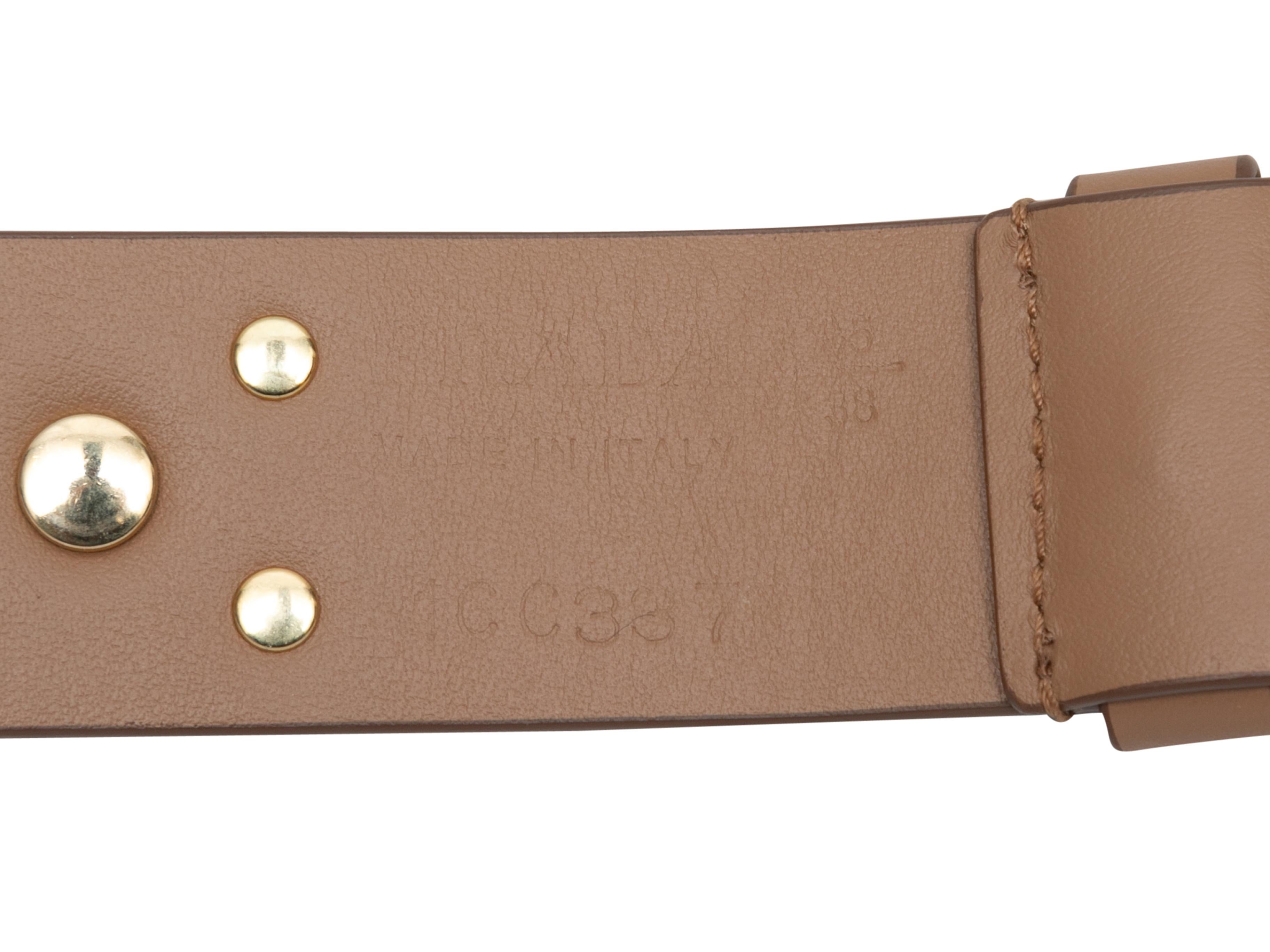 Brown leather studded belt by Prada. Gold-tone hardware. Buckle closure. 1.75