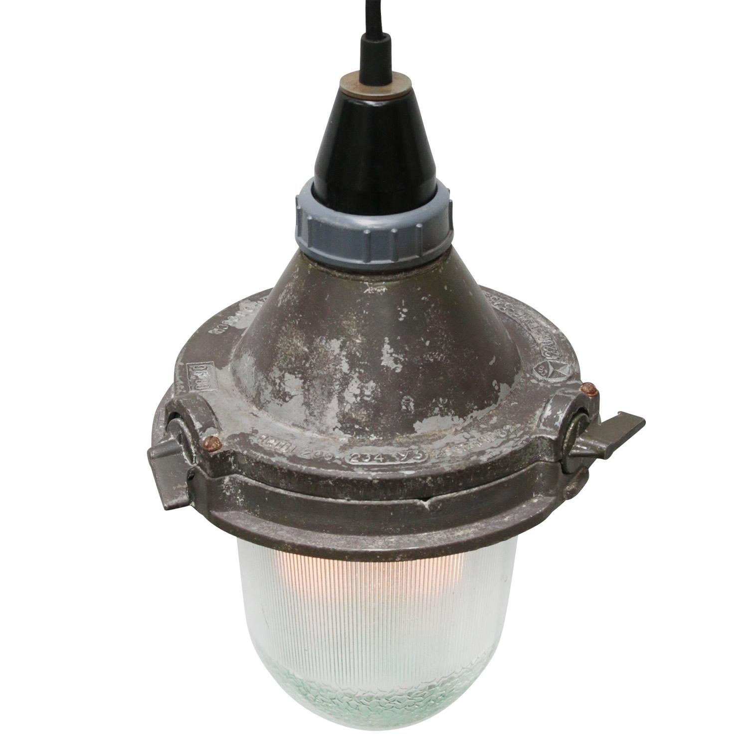 Brown Purple industrial pendant.
Aluminium with Bakelite top.
Clear striped glass. 

Weight: 1.00 kg / 2.2 lb

Priced per individual item. All lamps have been made suitable by international standards for incandescent light bulbs,