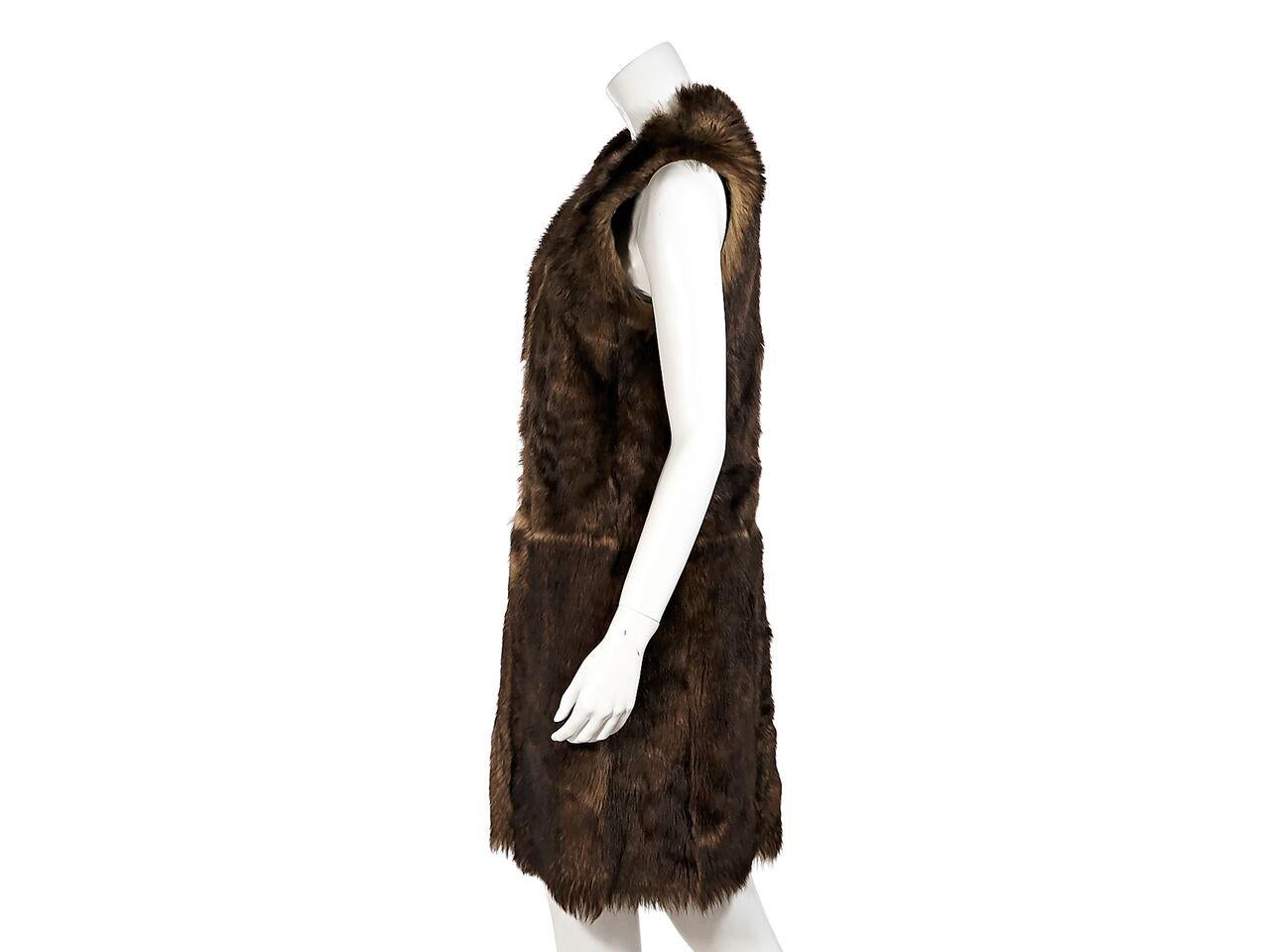 Product details:  Brown lamb shearling vest by Ralph Lauren Purple Label.  Sleeveless.  Concealed front closure.  Leather lining.  32