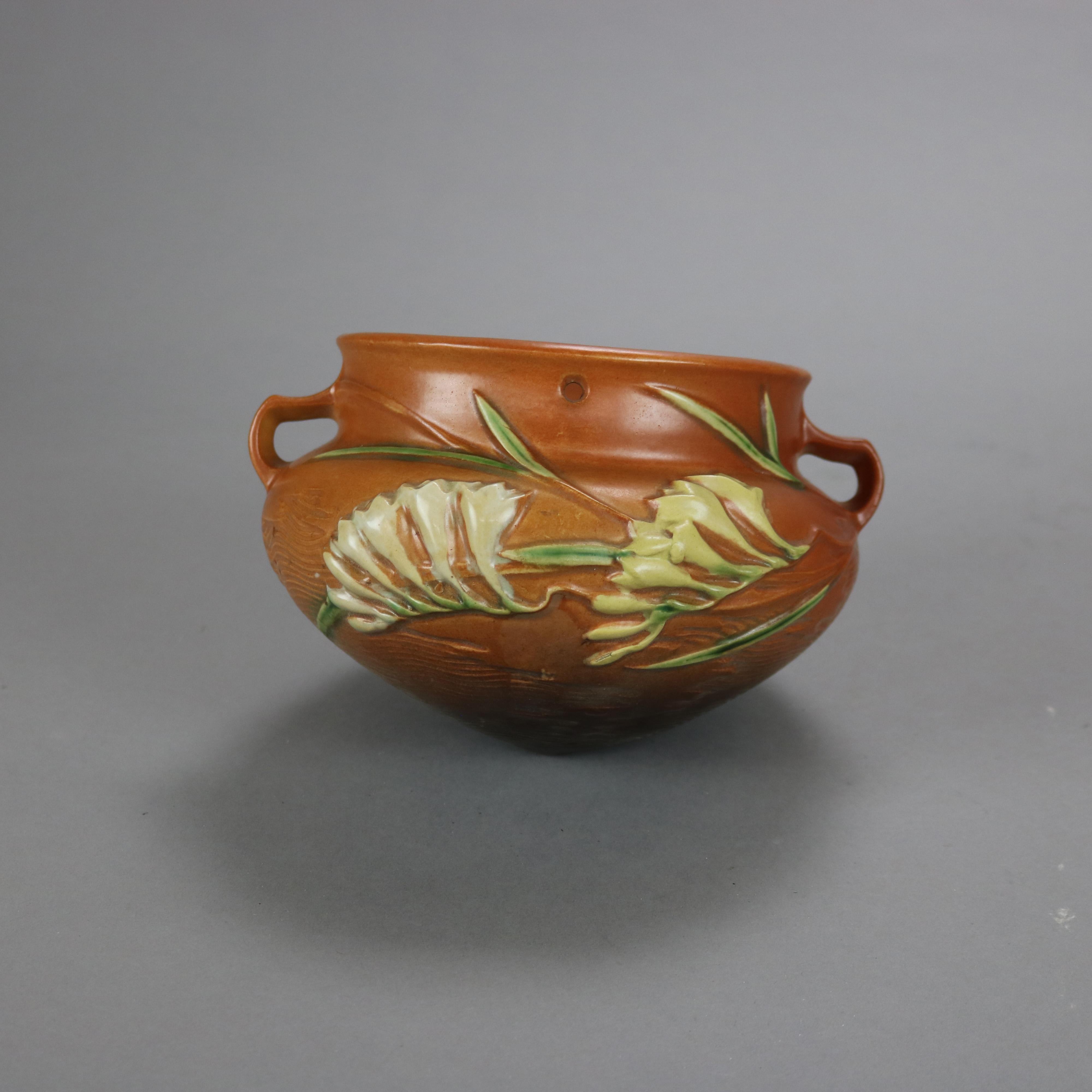 20th Century Brown Roseville Art Pottery Hanging Planter with Freesia Pattern Mid 20thC