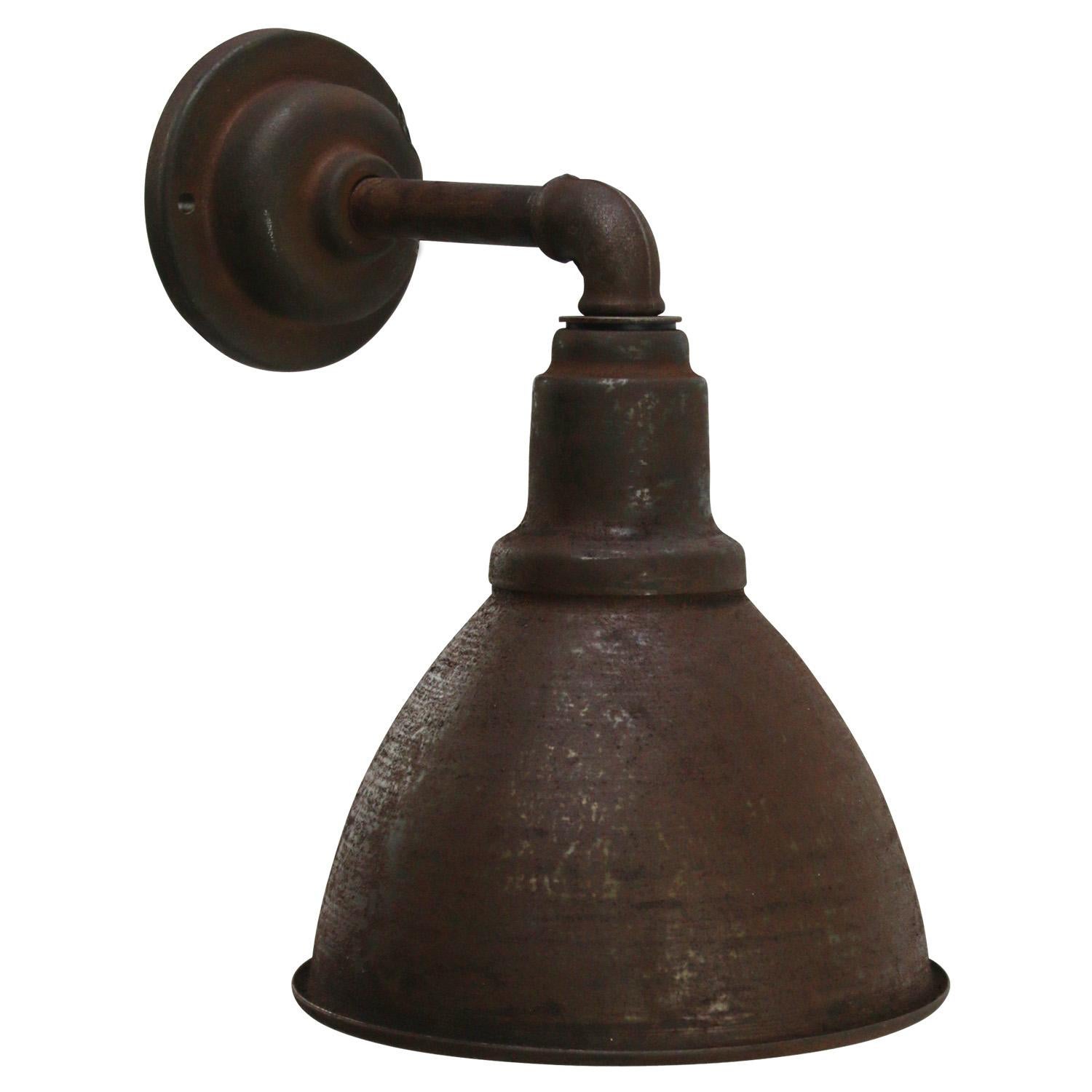 Factory wall light
Iron shade, cast iron arm and wall plate

diameter cast iron wall piece: 10 cm, 2 holes to secure

Weight: 1.80 kg / 4 lb

Priced per individual item. All lamps have been made suitable by international standards for