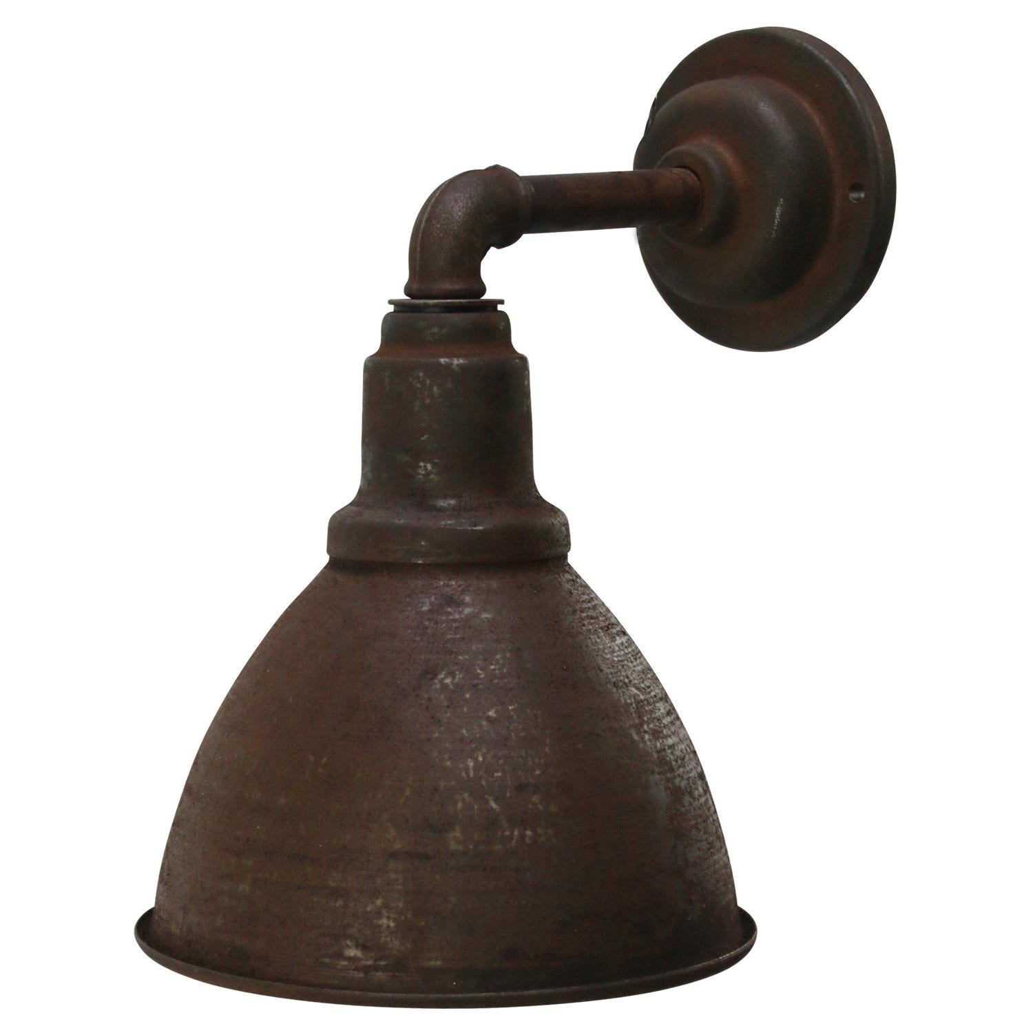 Factory wall light
Iron shade, cast iron arm and wall base

diameter cast iron wall piece: 10.5 cm / 4”, 2 holes to secure

Weight: 1.80 kg / 4 lb

Priced per individual item. All lamps have been made suitable by international standards for