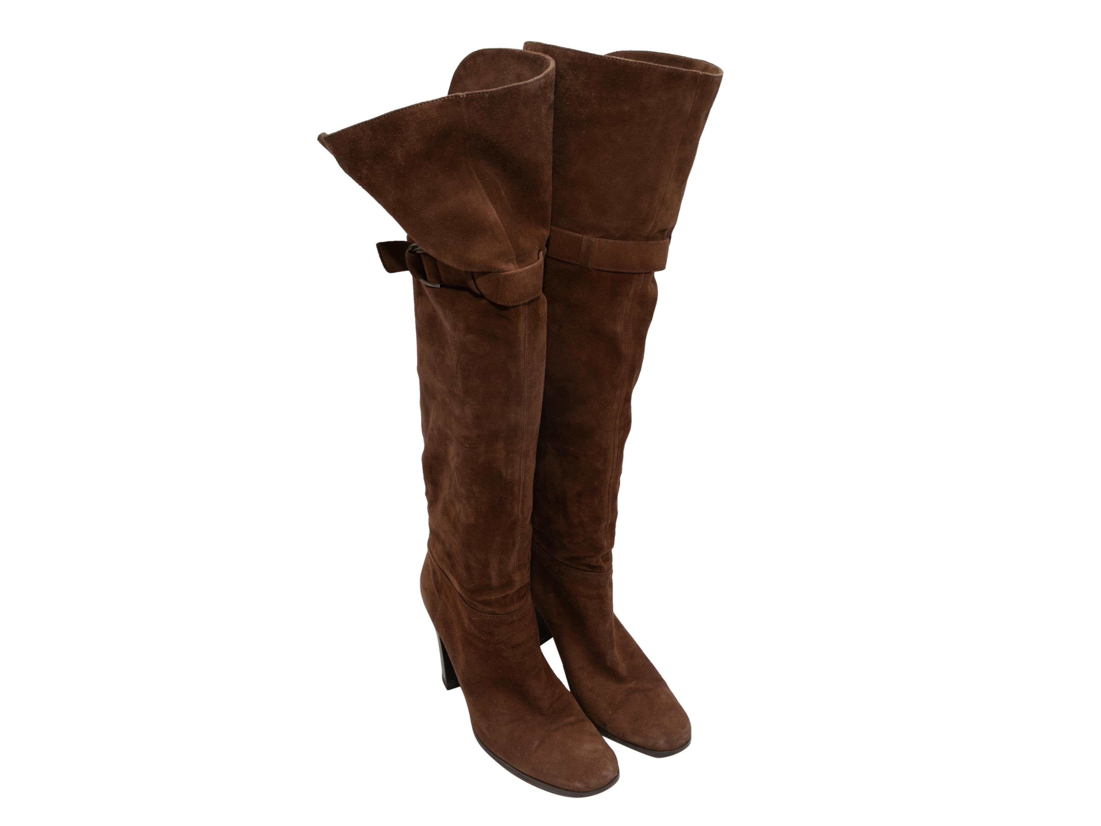 Brown knee-high suede boots by Sergio Rossi. Buckle accents at sides. Stacked heels. 18