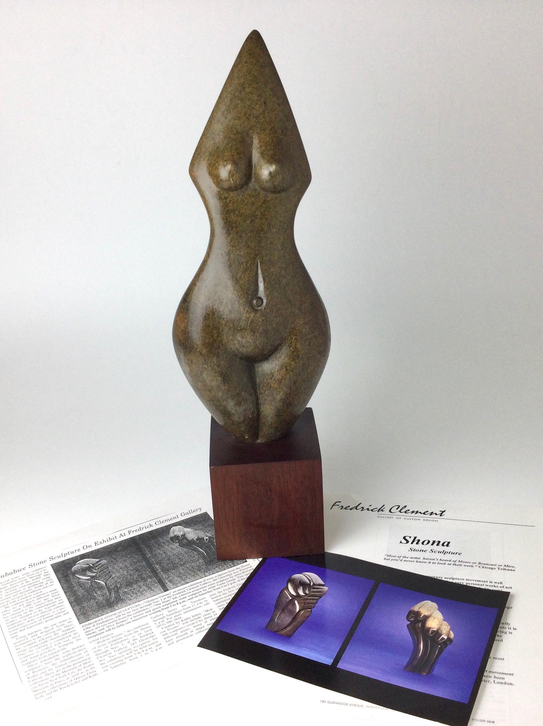 Wonderful carved brown serpentine stone by Mitsiati Kagore. Acquired from the Fredrick Clement Gallery Montclair NJ in 2000. It was shown in there “Modern Visions” exhibit of Zimbabwe Stone Sculpture. Stands on wood base 18” tall by 5 1/2” wide by