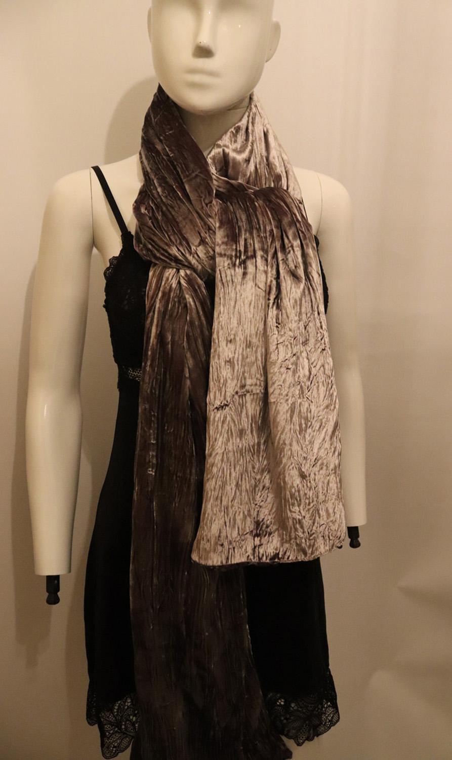 A wonderful and luxurious brown silk velvet shawl/scarf, ideal for January. The shawl is in a cross dyed velvet with two colours. The opposing colours create an iridescent affect which  glimmers in the light. It is edged with amethyst beads. 
82%