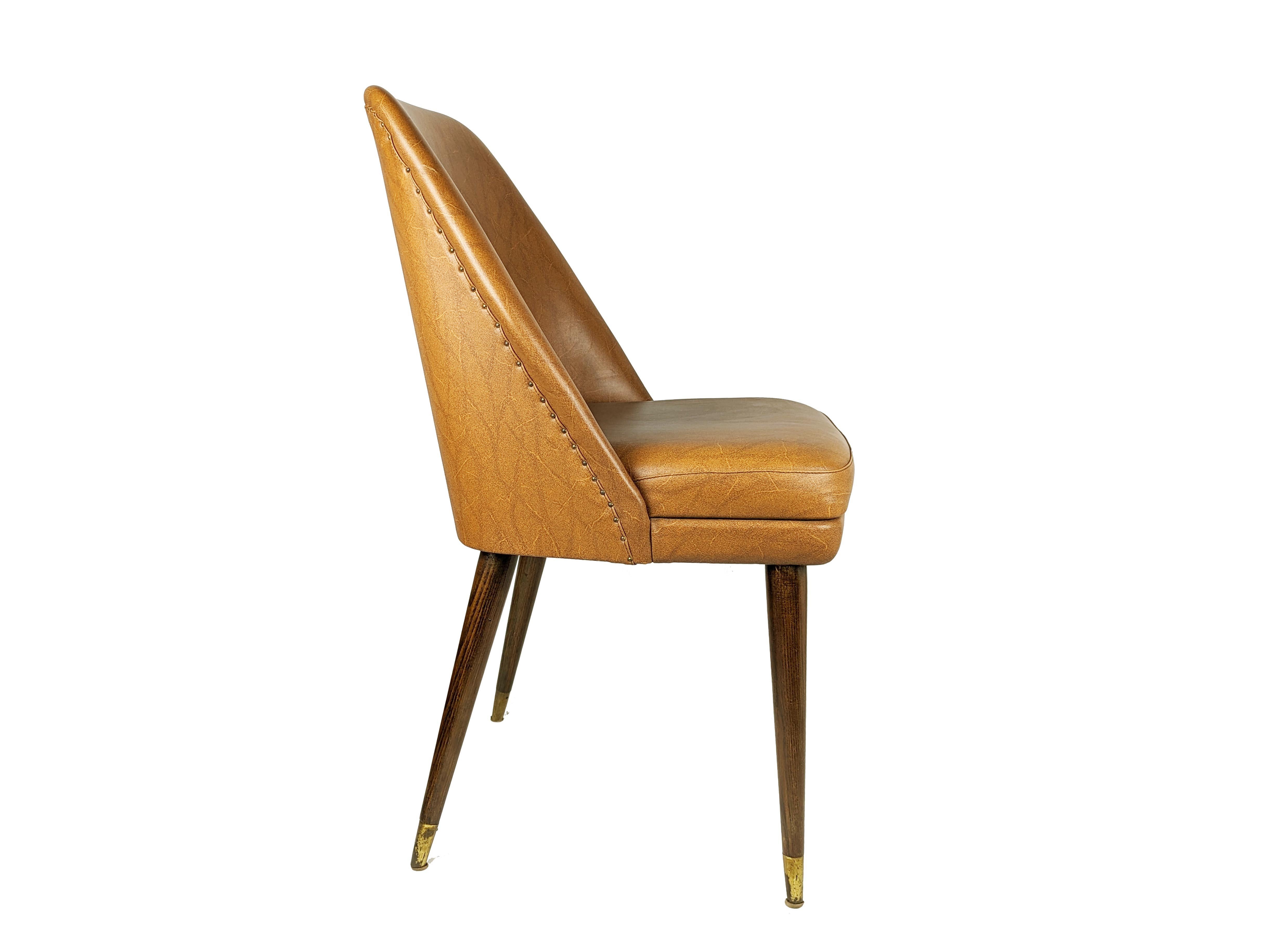 Set of 2 Mid Century modern chairs designed in 1956 by Carlo Pagani and manufactured by Figli di Amedeo Cassina. Good vintage condition: few skai defects; the wooden legs have been polished.

Carlo Pagani designed a similar model for Arflex in that